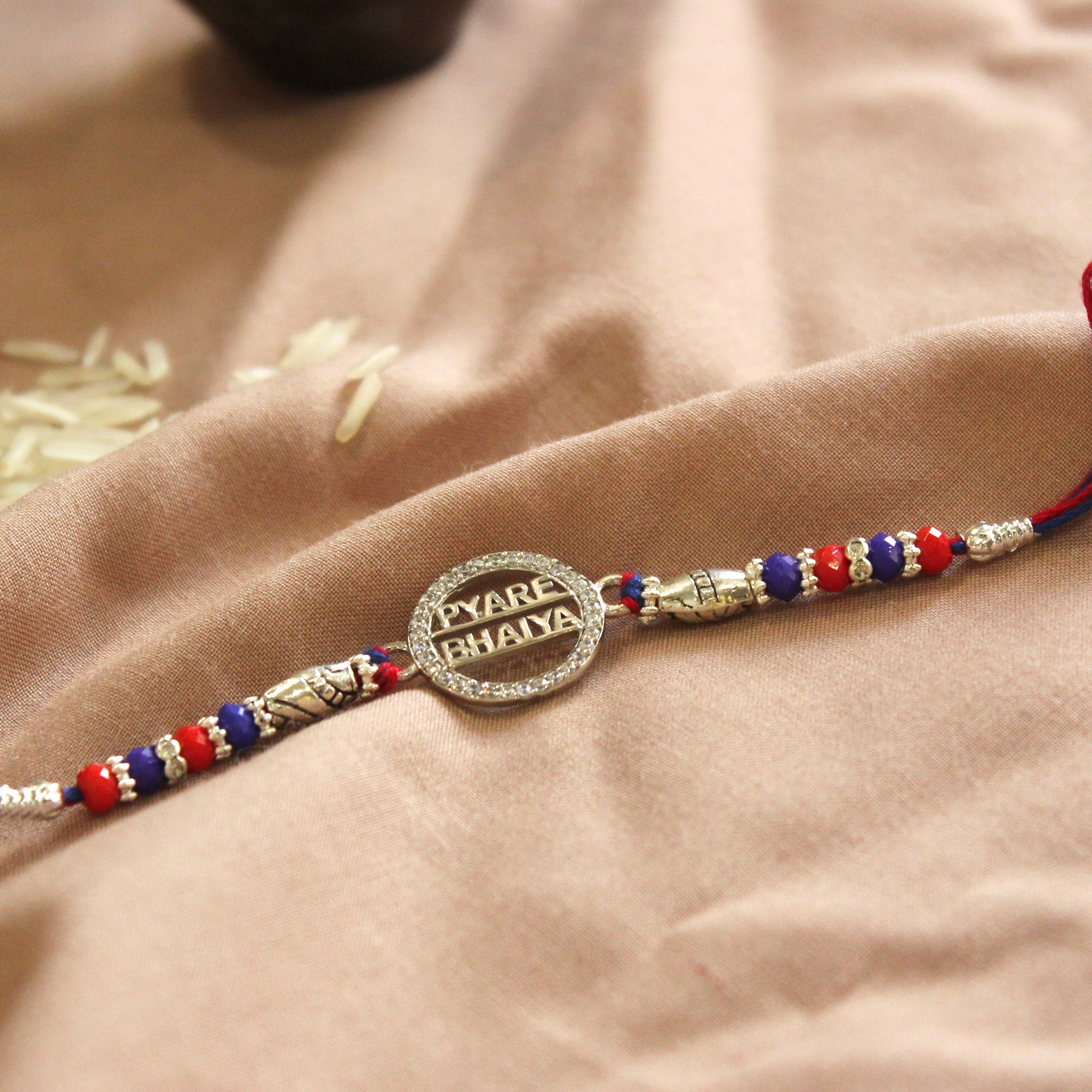 'PYARA BHAIYA' red thread rakhi in 925 silver