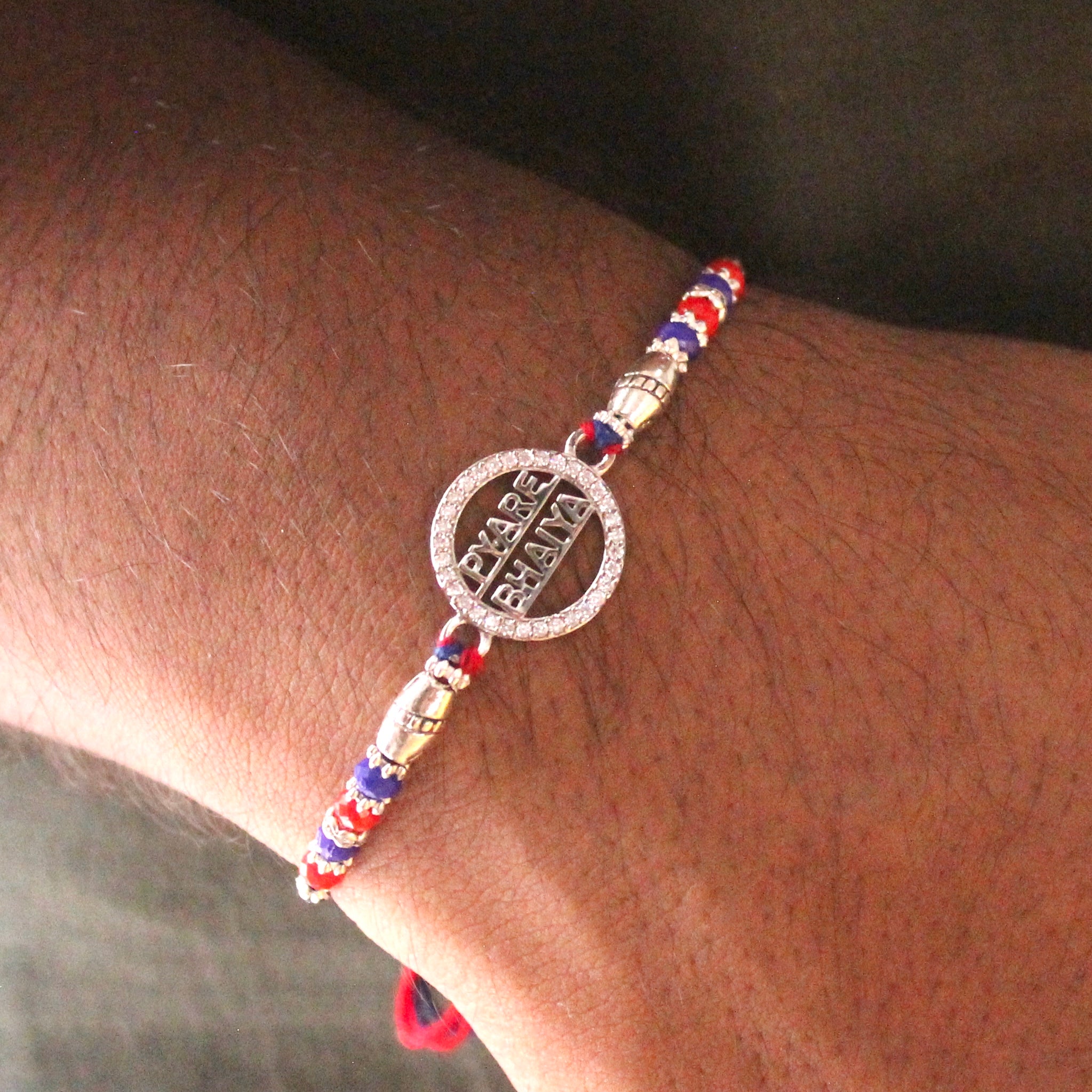 'PYARA BHAIYA' red thread rakhi in 925 silver