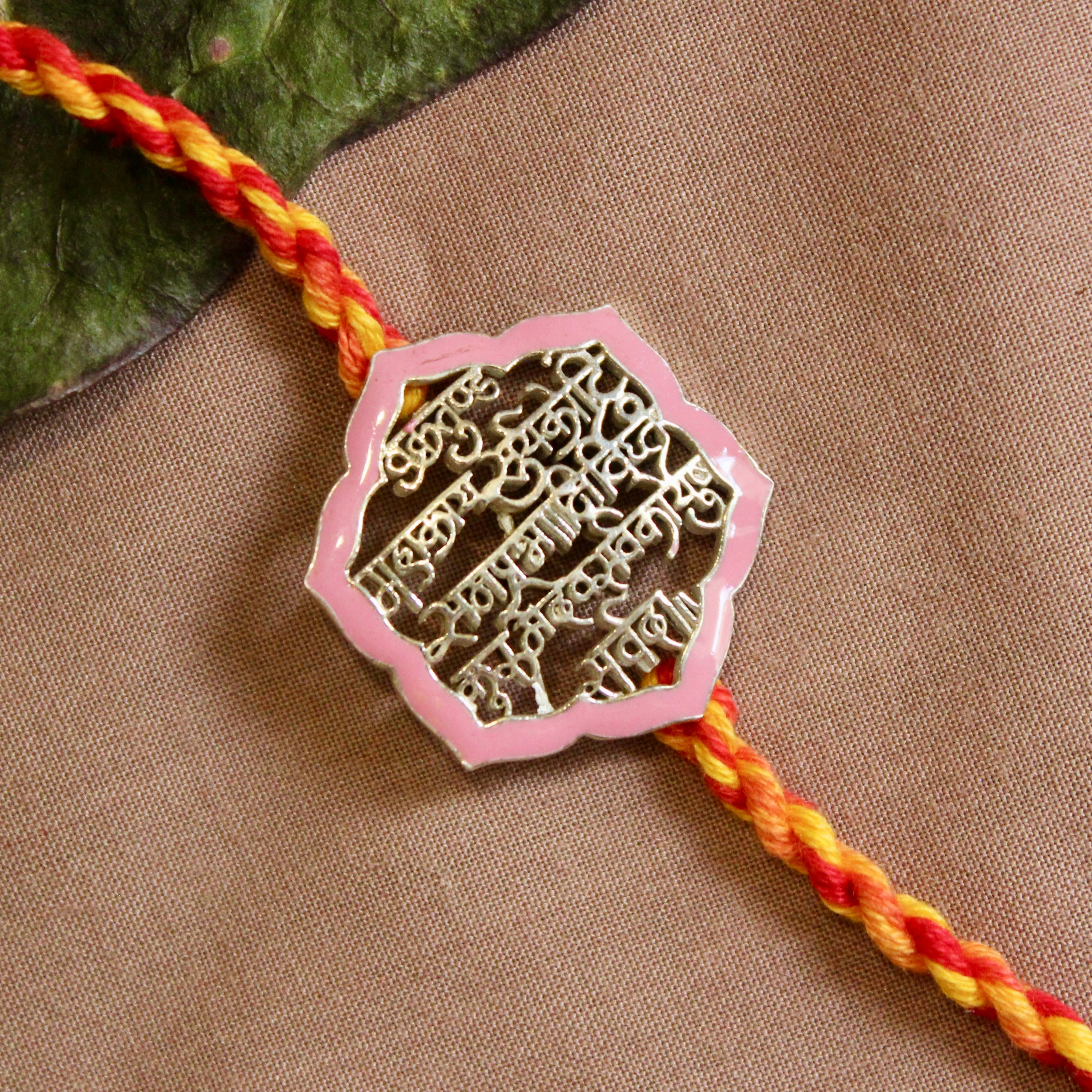 'Shlok' Red Yellow Thread Pink Rakhi in 925 Silver