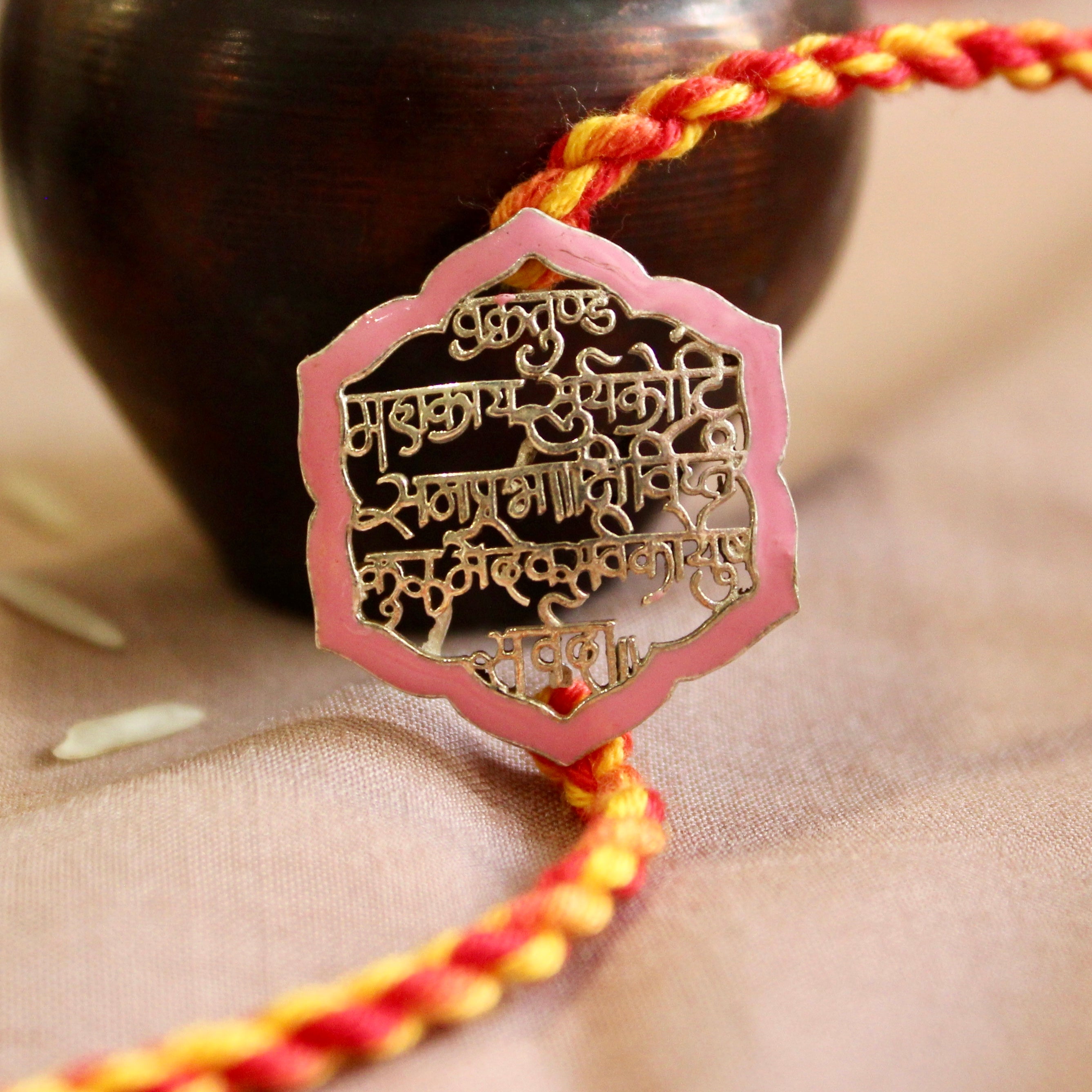 'Shlok' Red Yellow Thread Pink Rakhi in 925 Silver