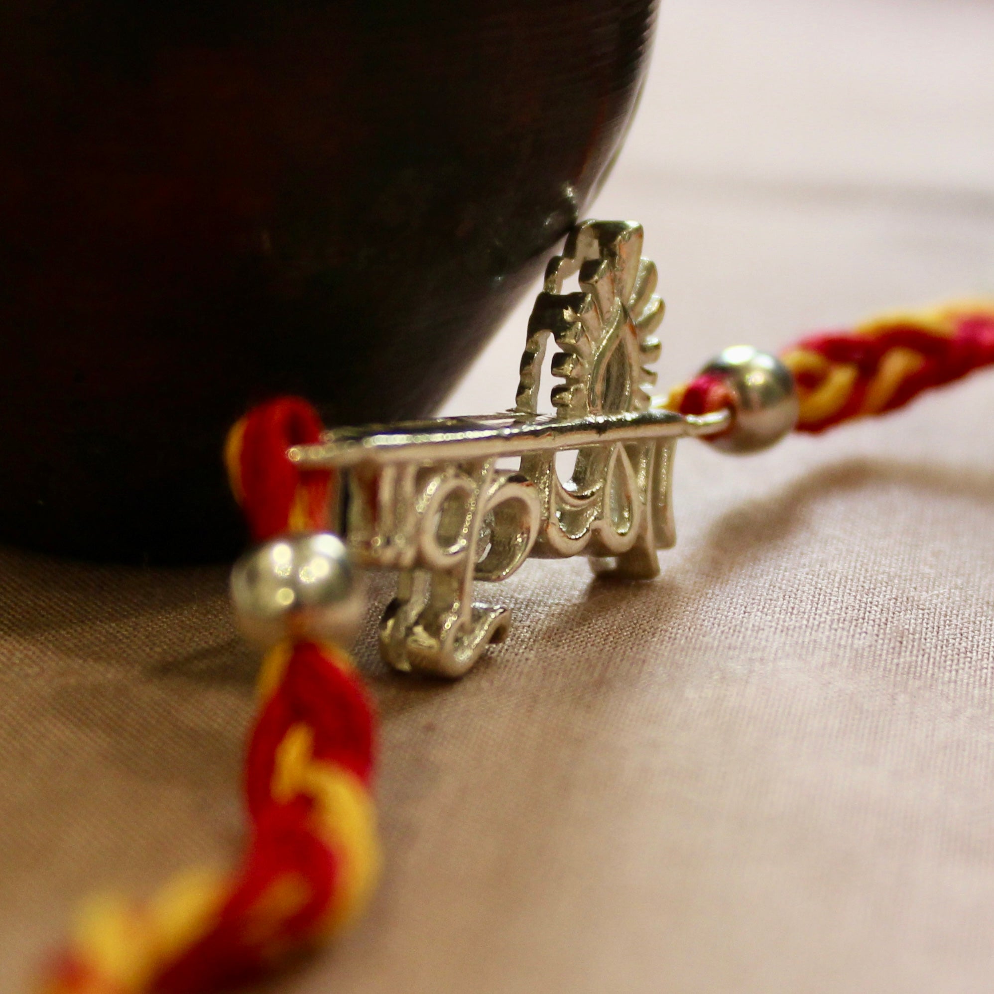 'KRISHNA' in hindi red yellow thread rakhi in 925 Silver