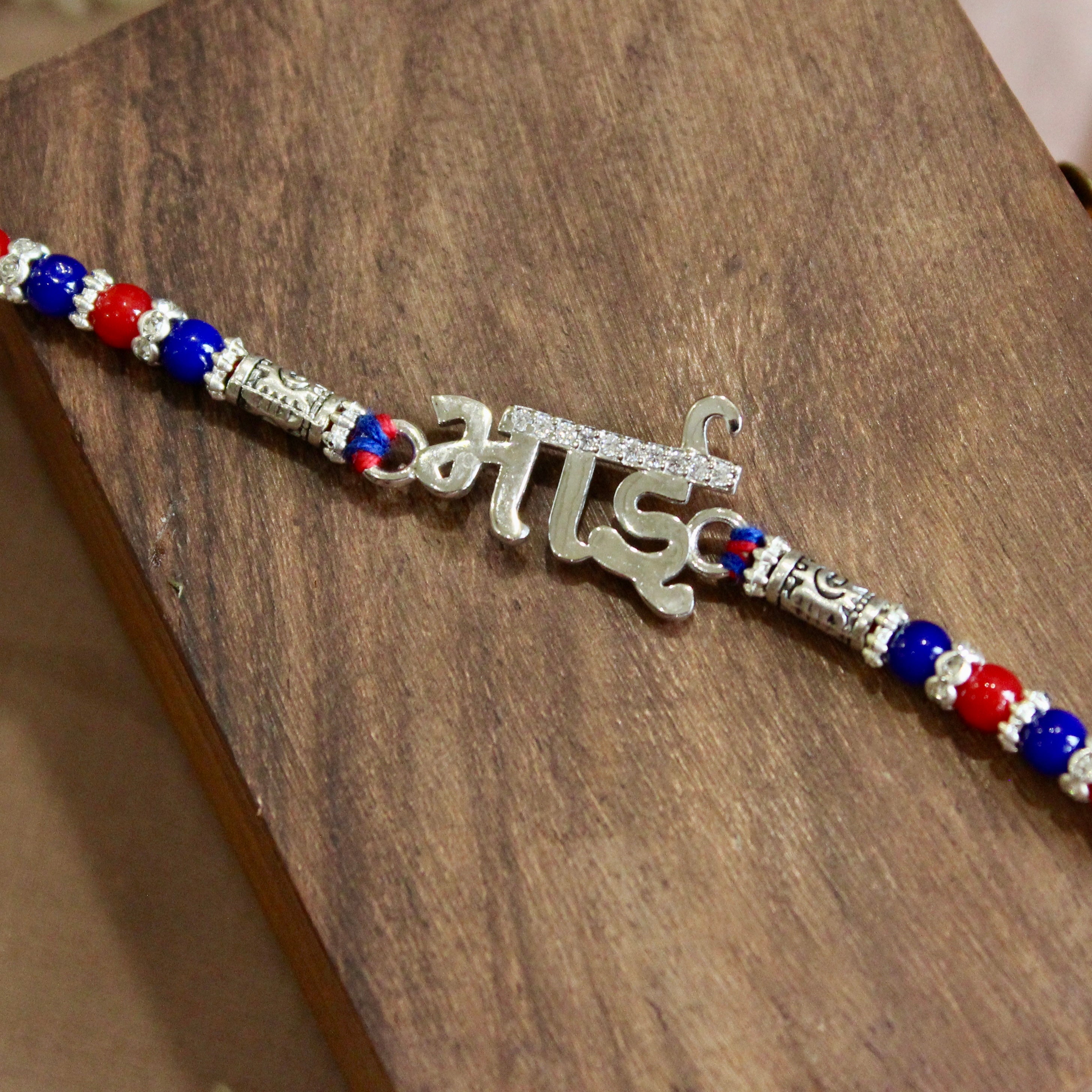 'BHAI' in Hindi red thread rakhi in 925 silver