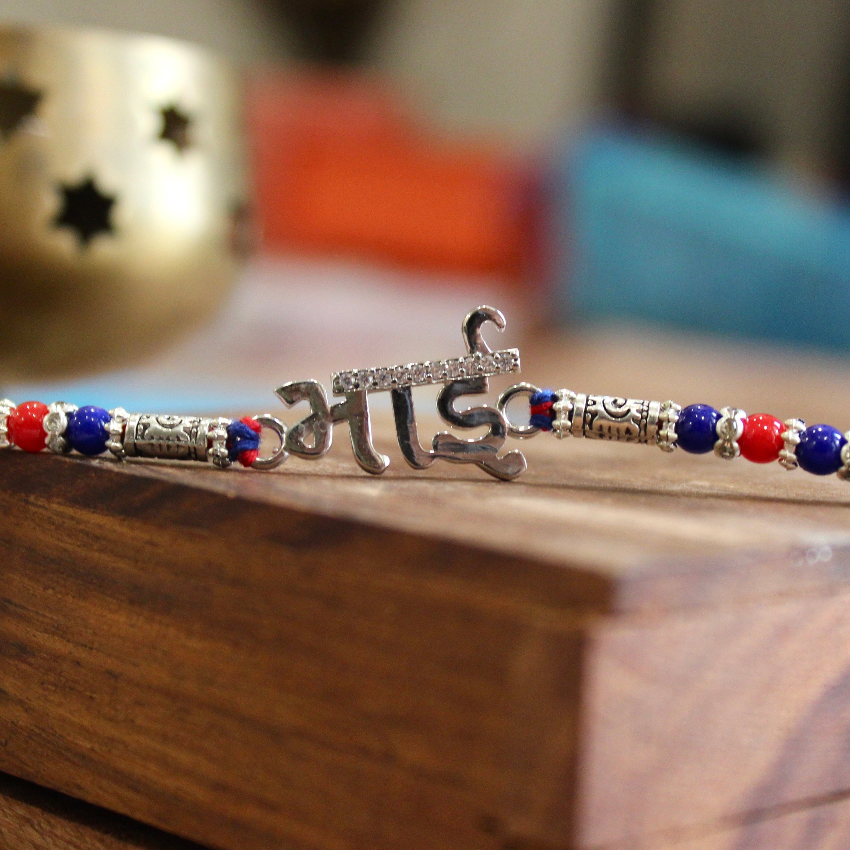 'BHAI' in Hindi red thread rakhi in 925 silver