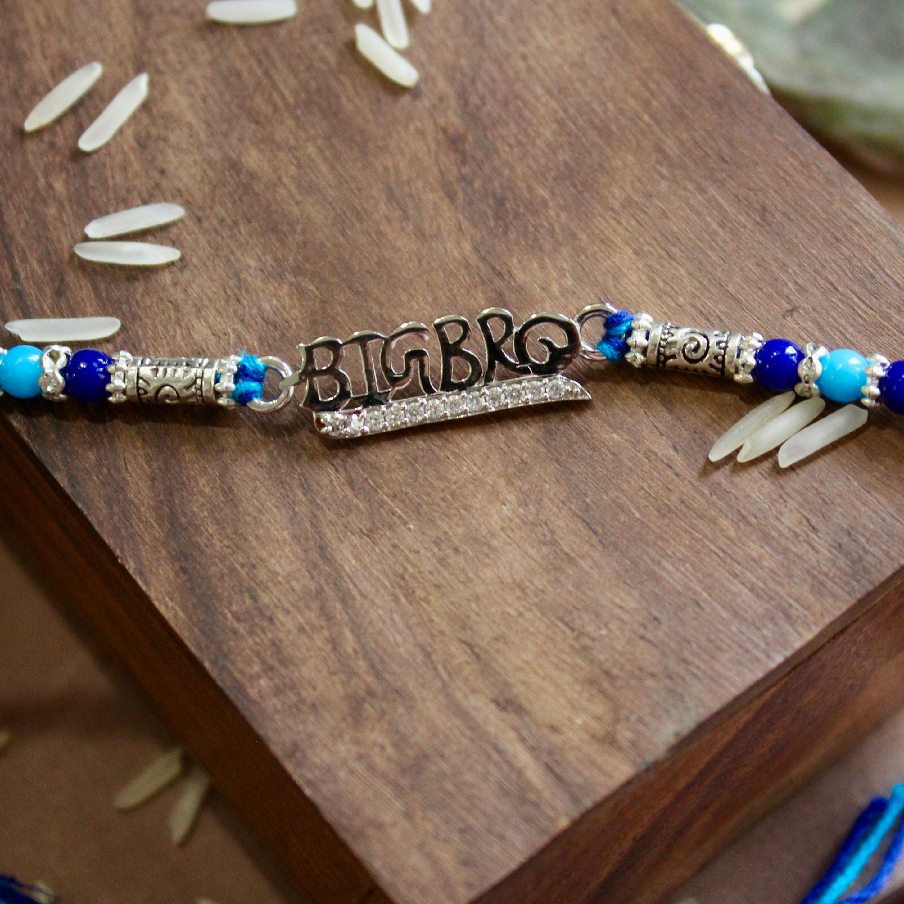 'BIG BRO' blue thread rakhi in 925 Silver