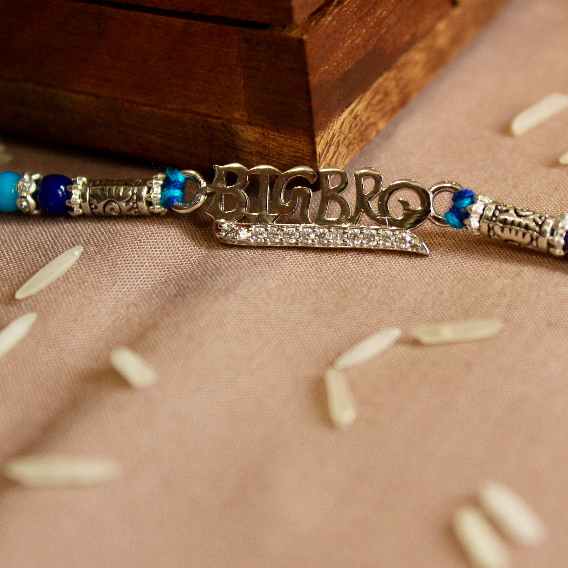 'BIG BRO' blue thread rakhi in 925 Silver