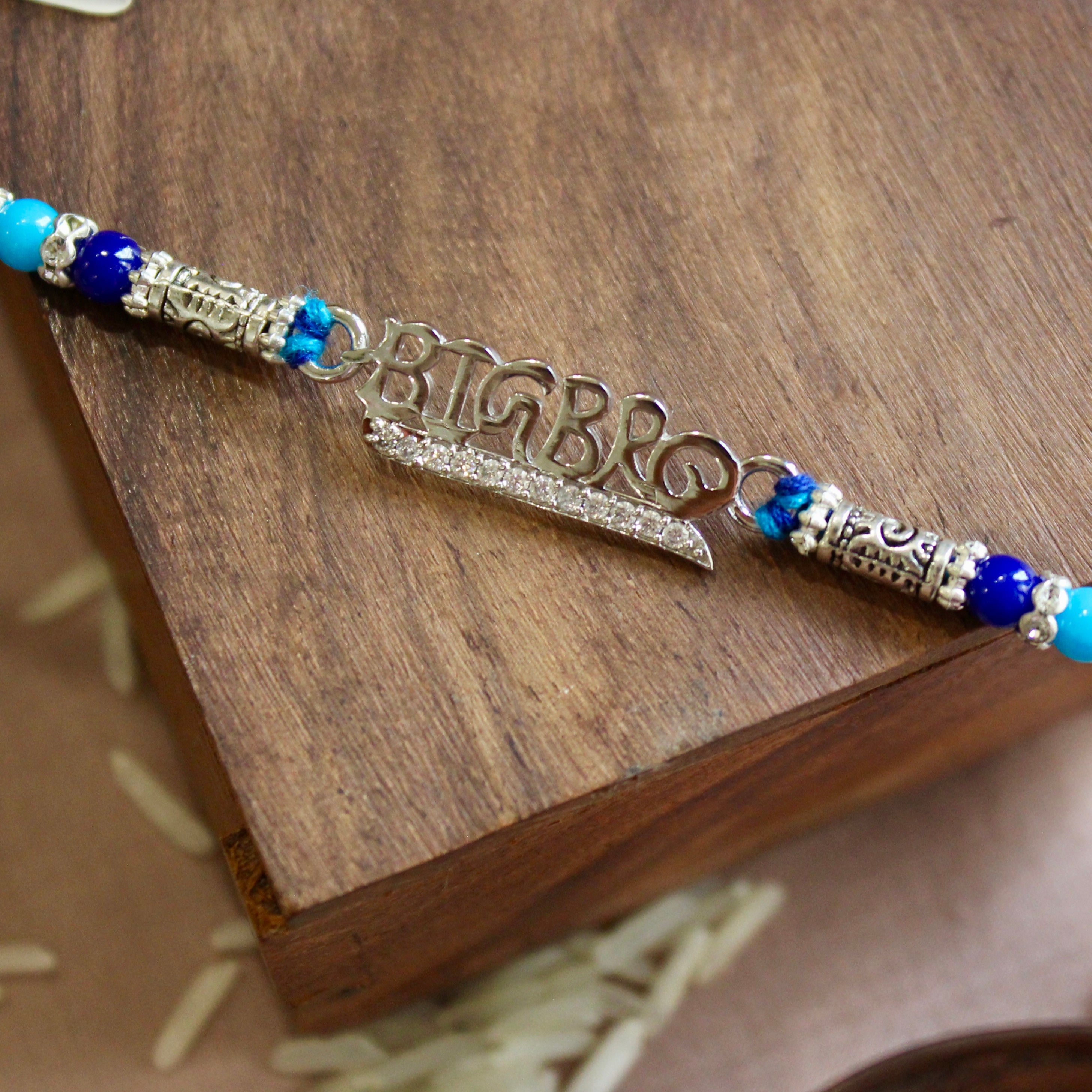'BIG BRO' blue thread rakhi in 925 Silver