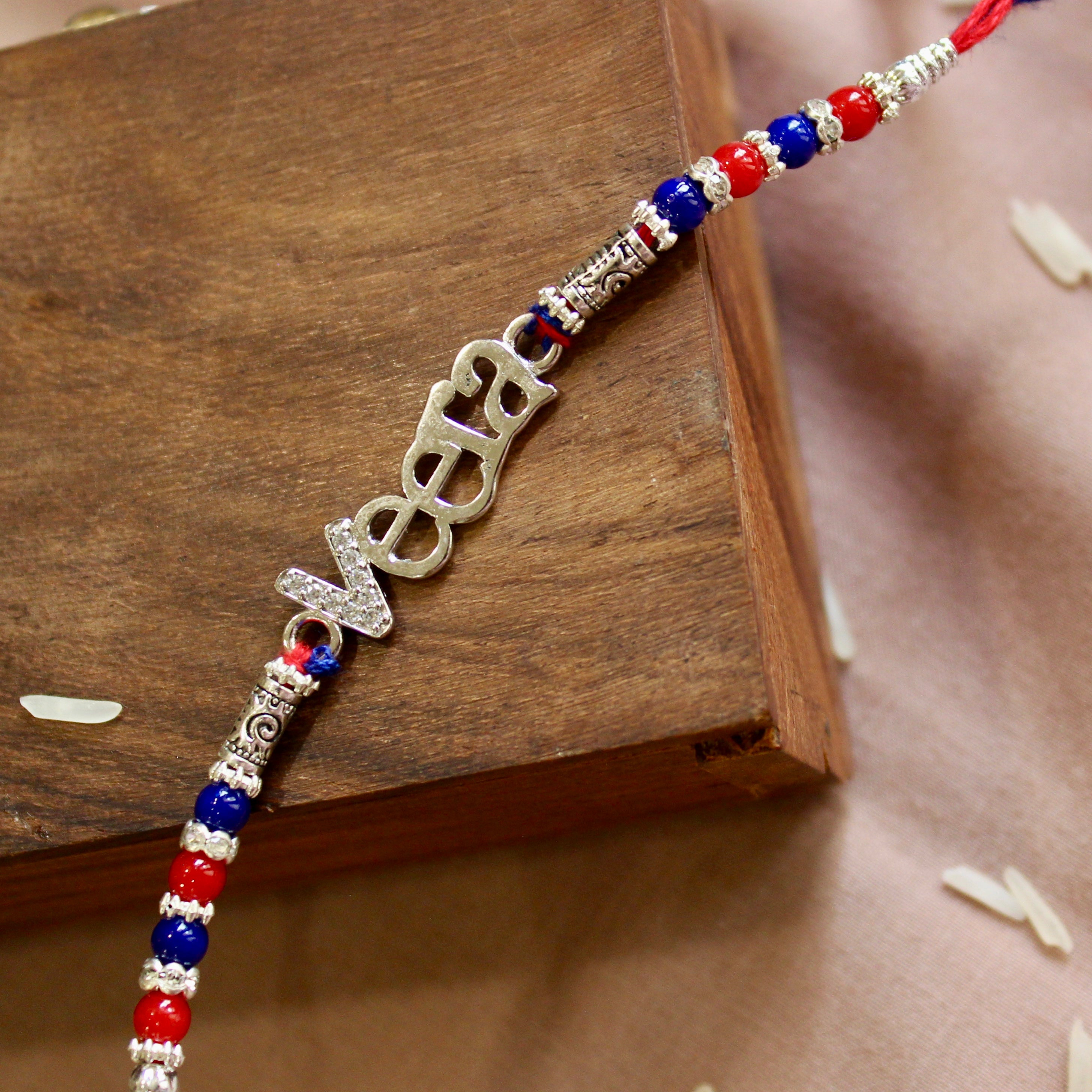 'VEERA' Red Thread Rakhi in 925 silver