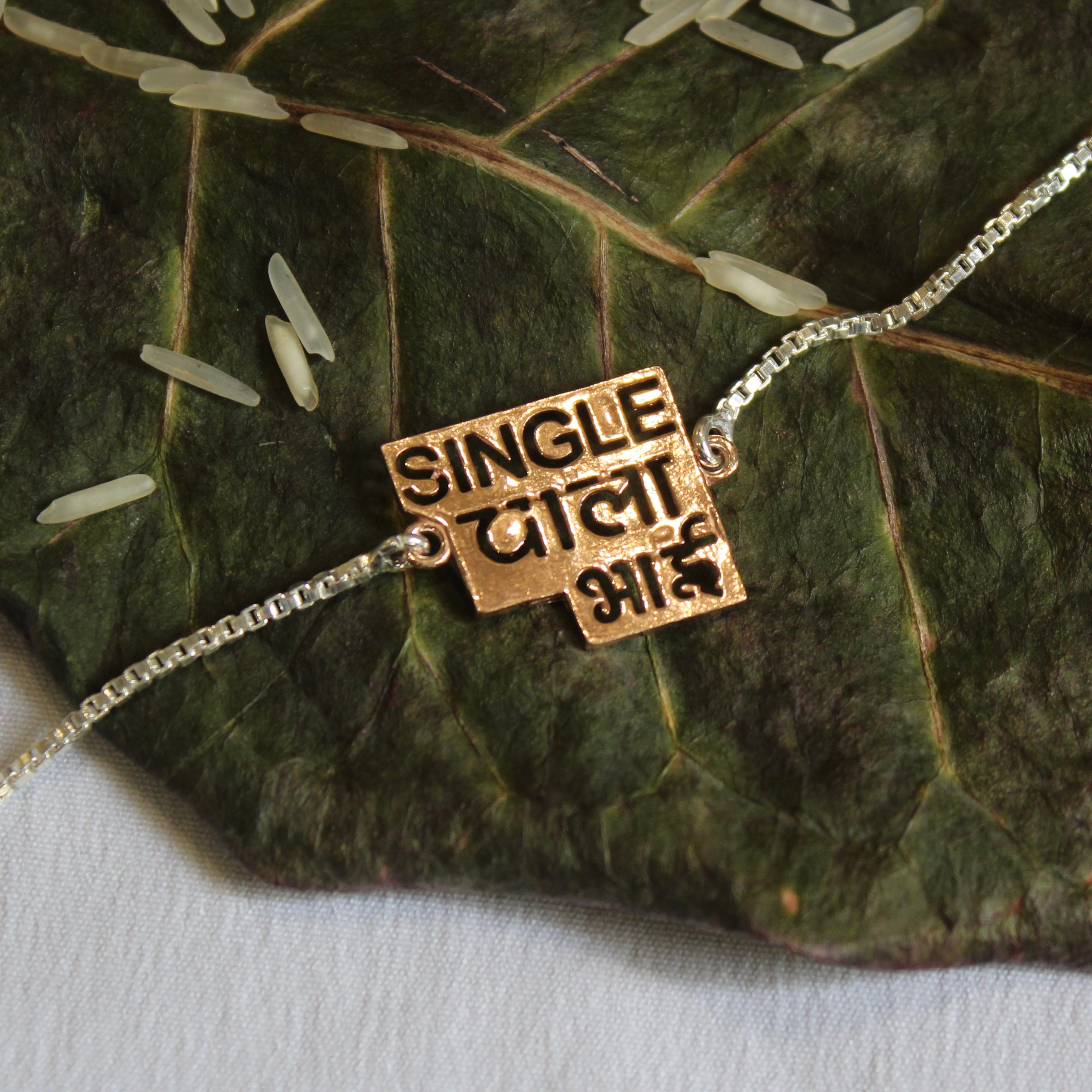 'SINGLE WALA BHAI' 925 Silver Chained Rakhi in rose gold polish
