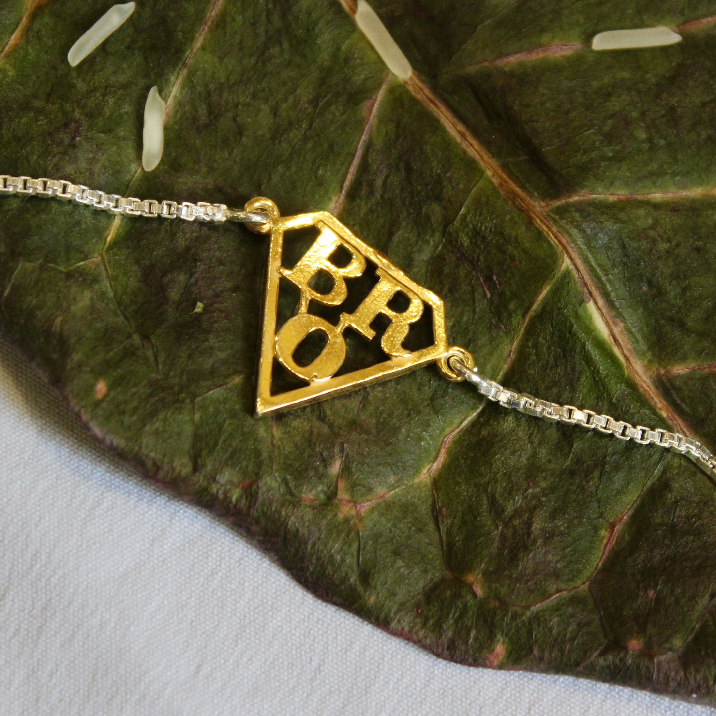 'SUPERMAN BRO' 925 Pure Silver Chained Rakhi in Gold Polish