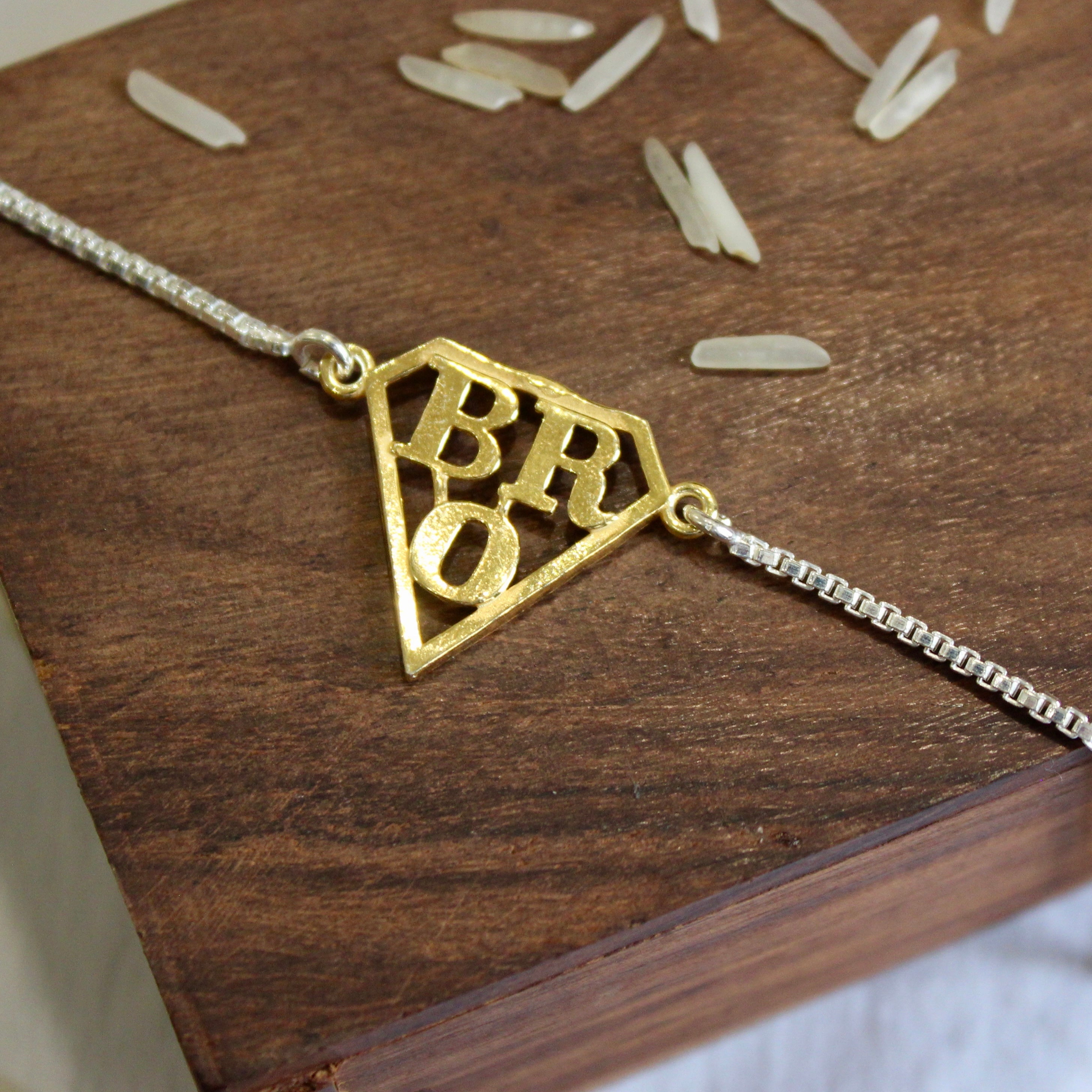 'SUPERMAN BRO' 925 Pure Silver Chained Rakhi in Gold Polish