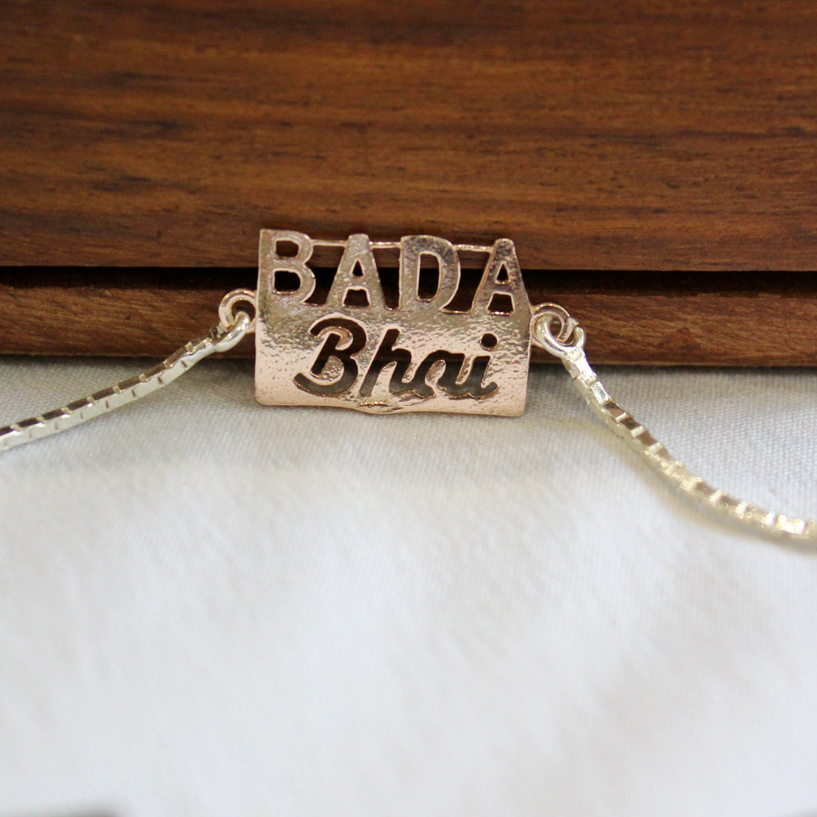 'Bada Bhai' Pure Silver Chained Rakhi in rose gold polish