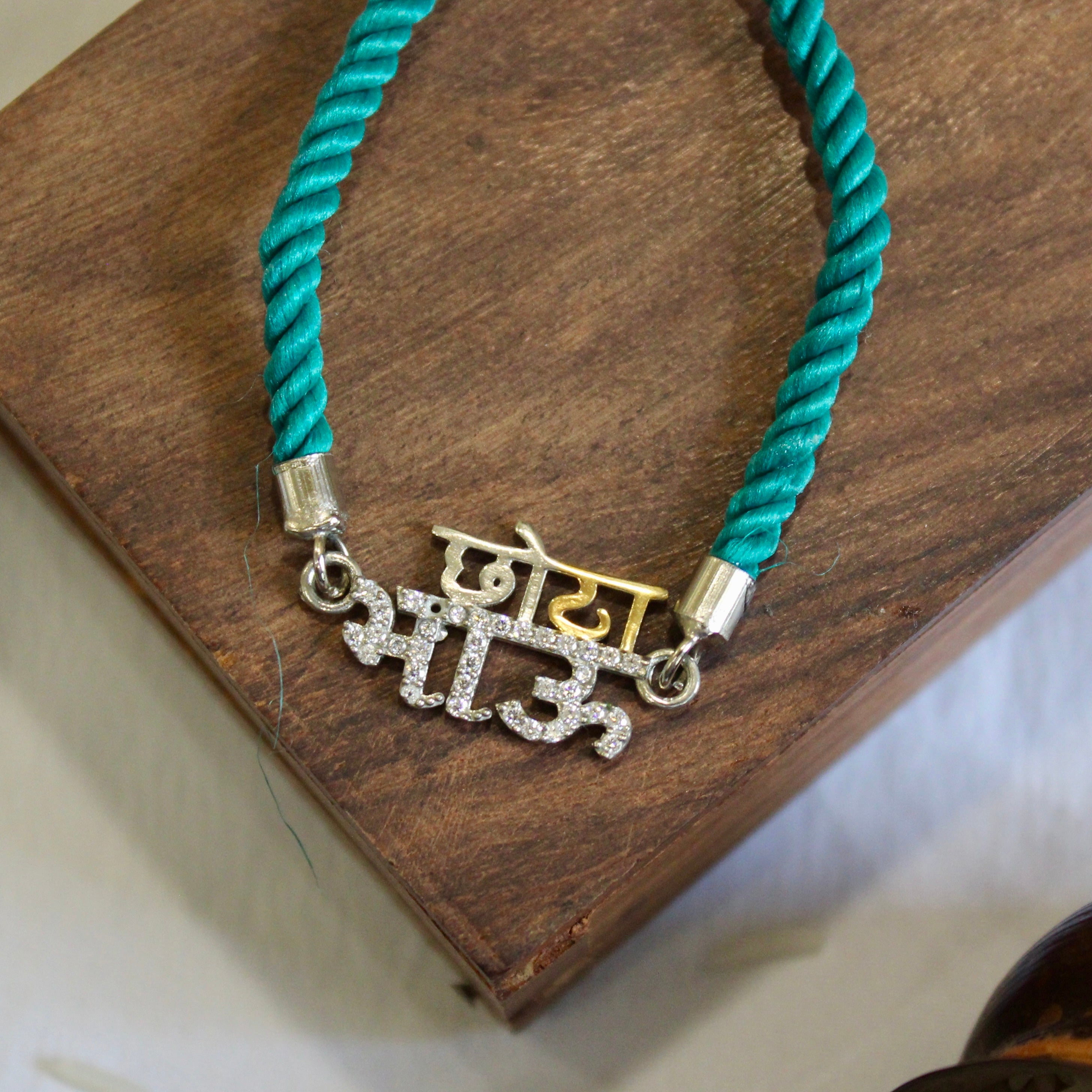 'CHHOTA BHAU' Green Thread Rakhi in 925 Silver