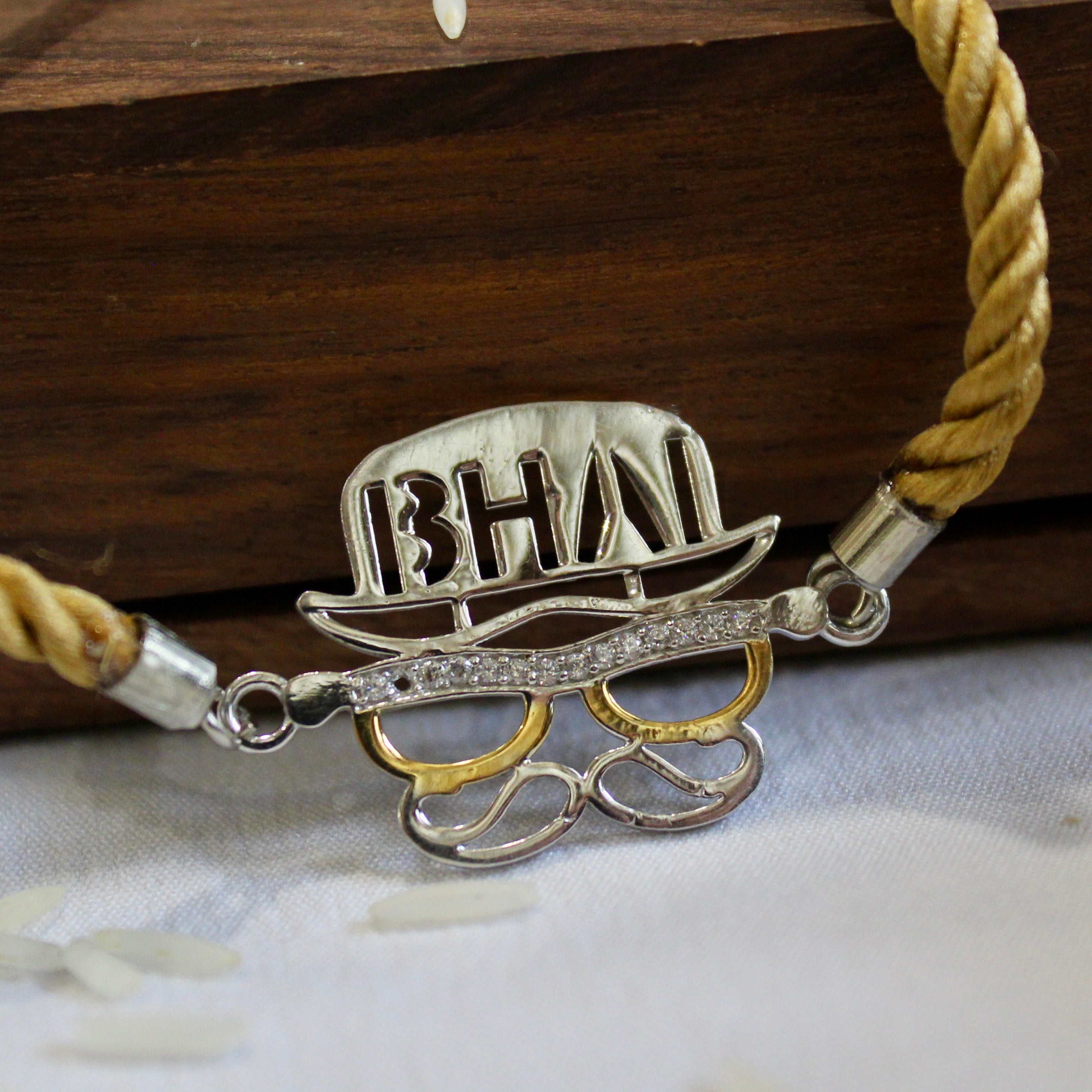 'BHAI WITH HAT' Golden Thread Rakhi in 925 Silver