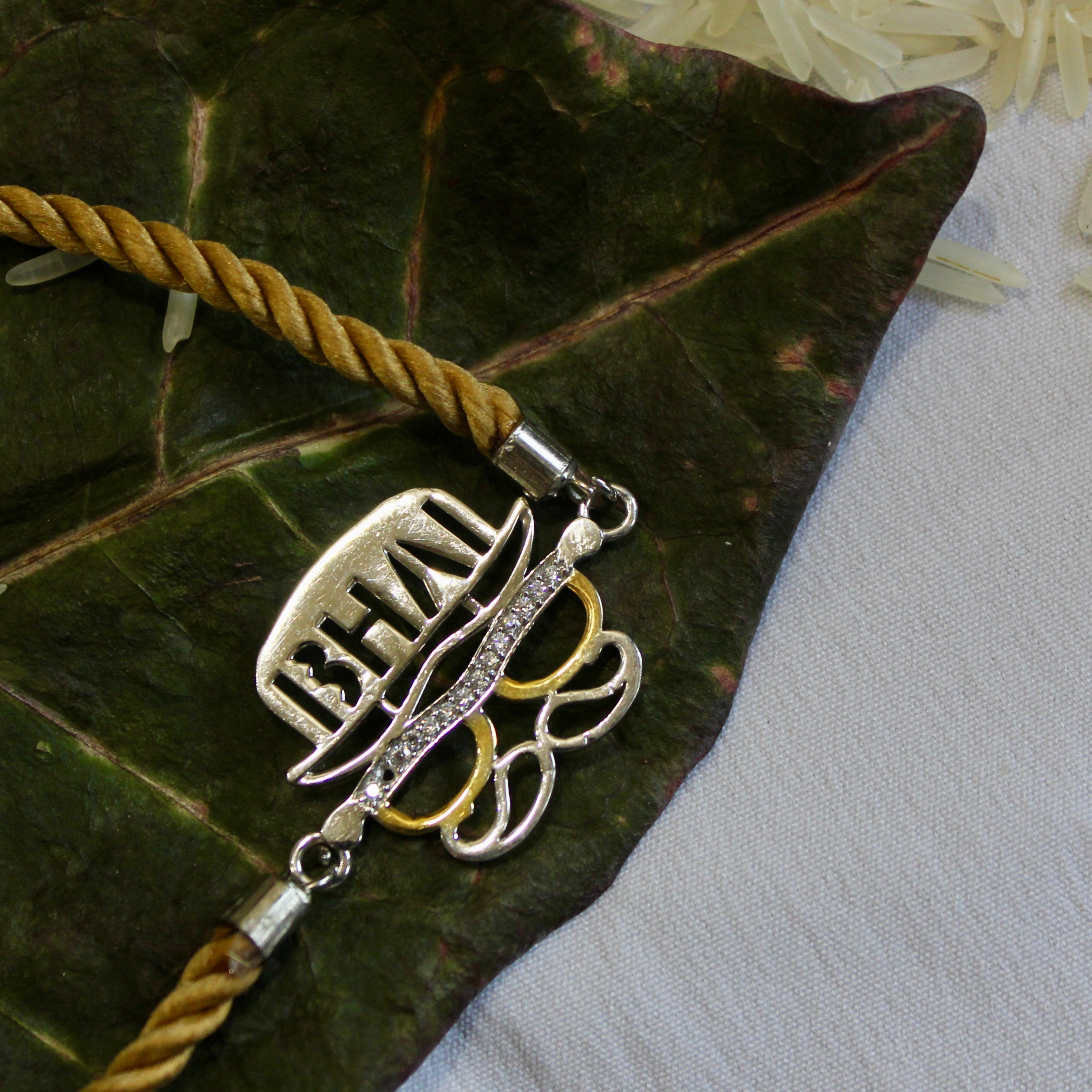 'BHAI WITH HAT' Golden Thread Rakhi in 925 Silver