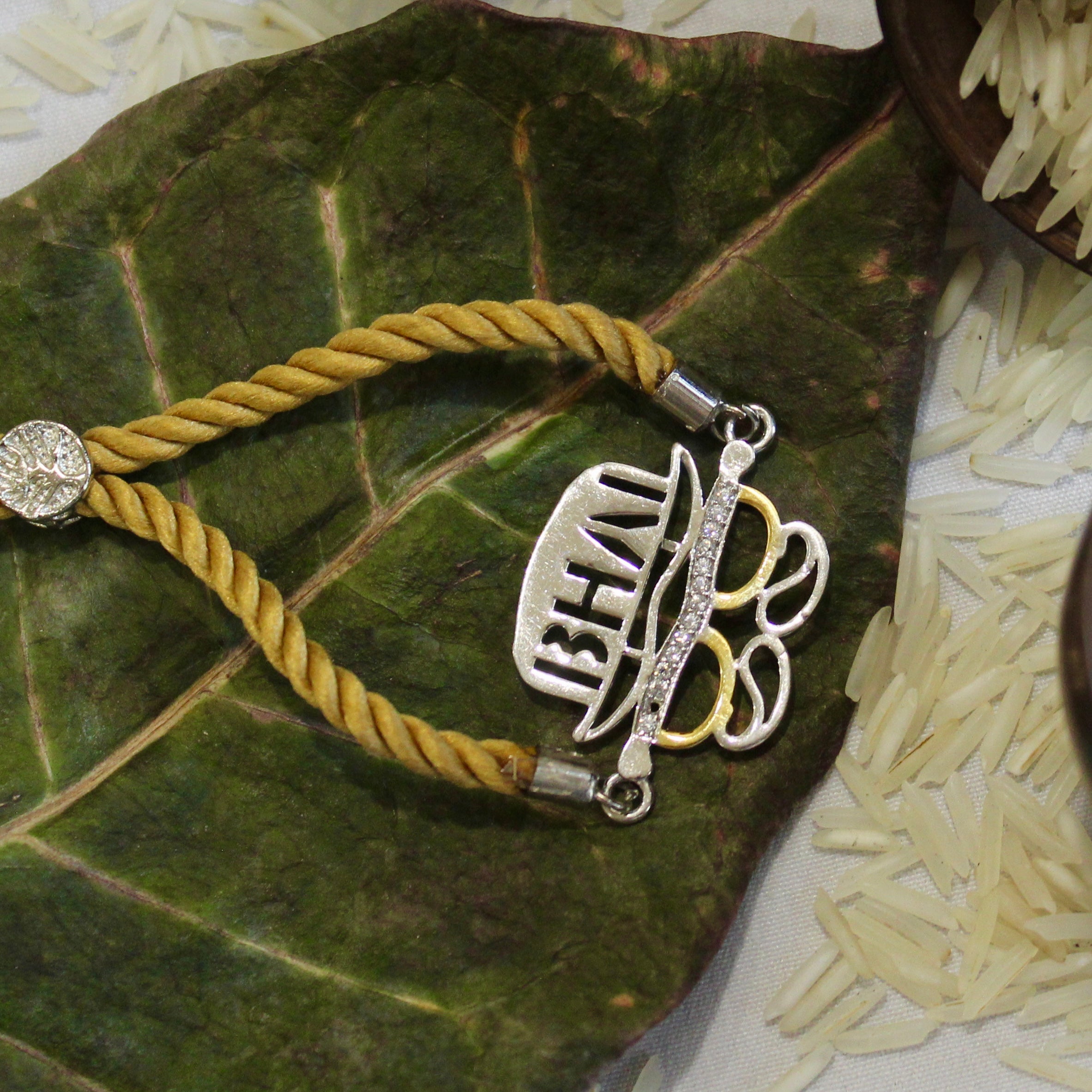 'BHAI WITH HAT' Golden Thread Rakhi in 925 Silver