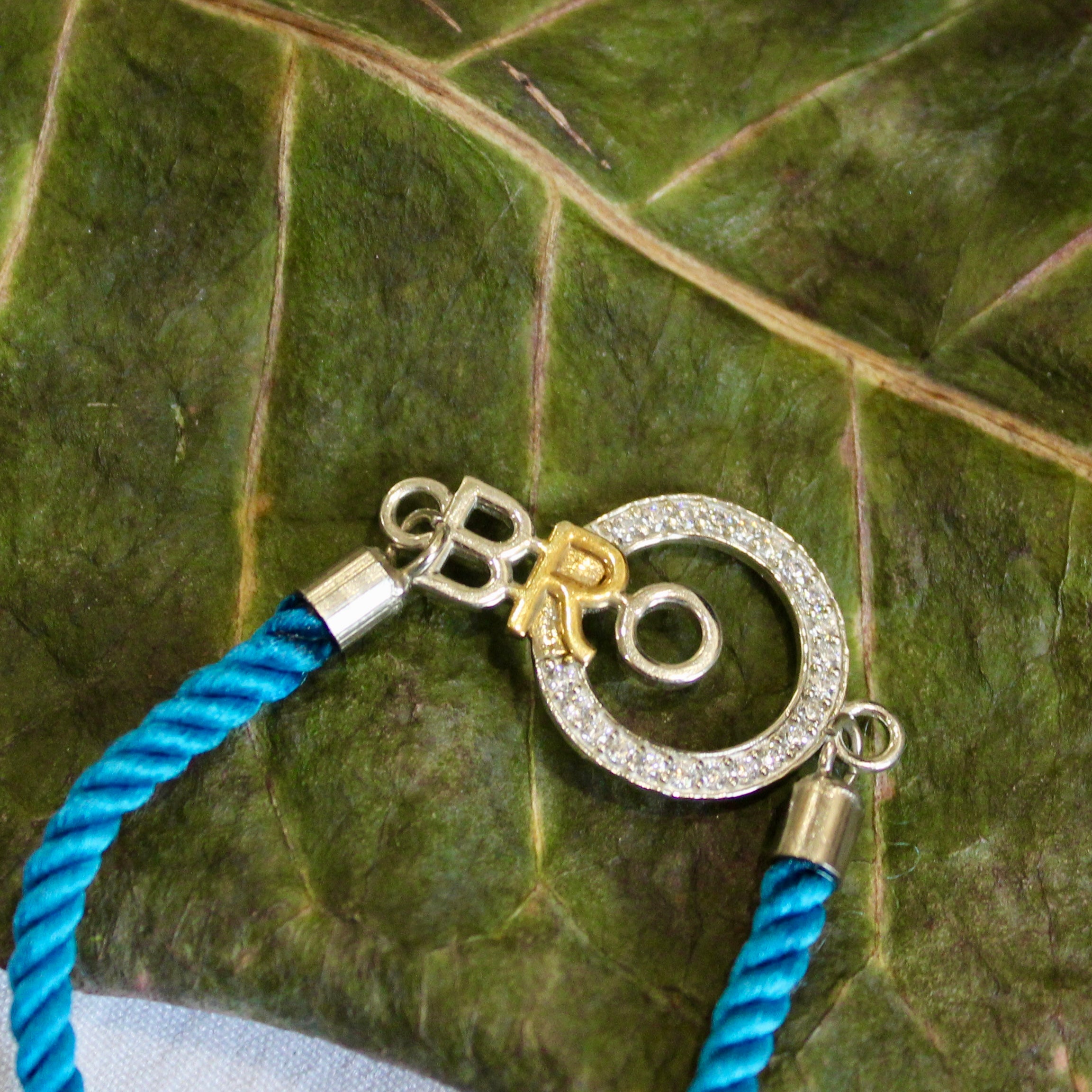 'Bro With Circle' Blue Thread Rakhi in 925 Silver