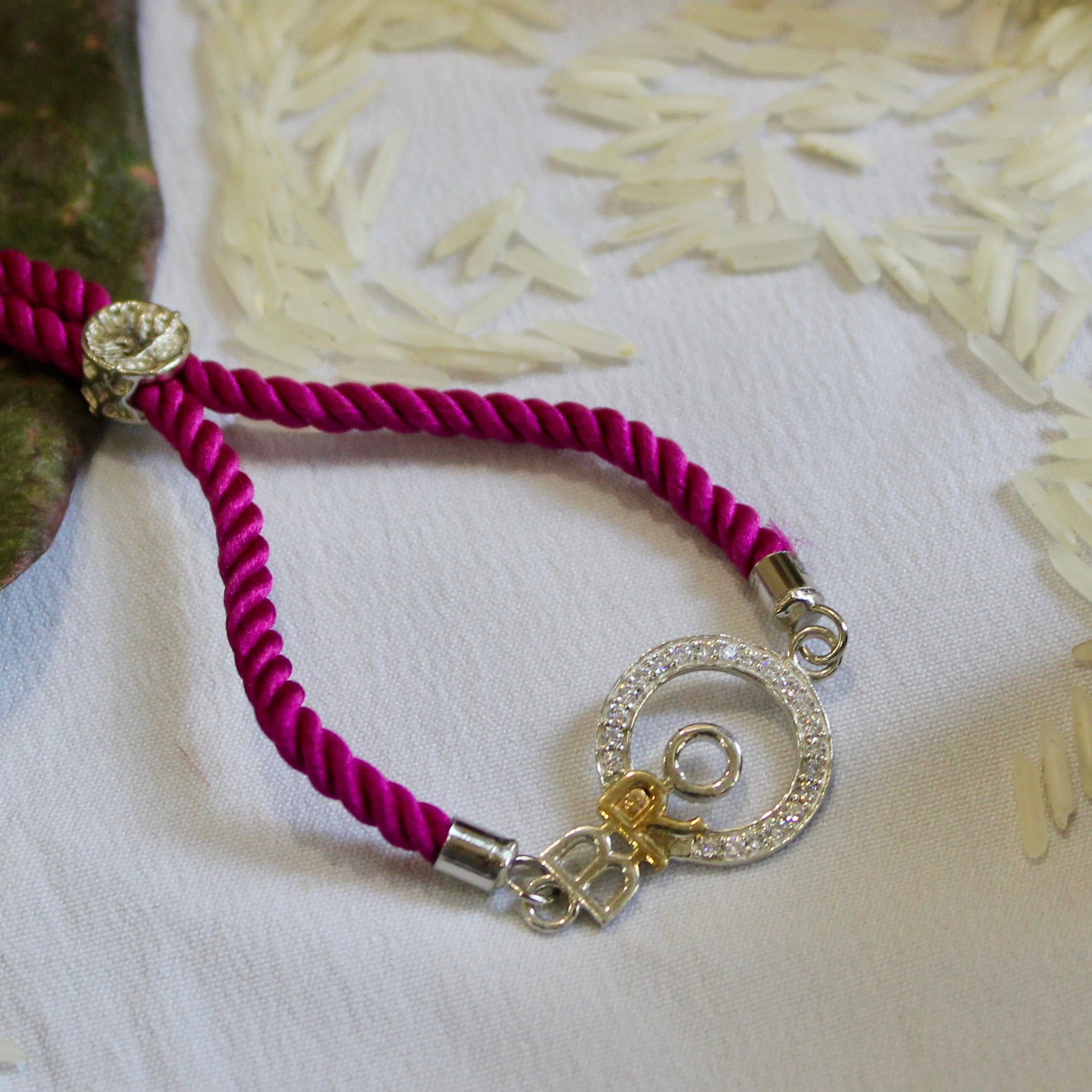 'BRO with circle' purple thread rakhi in 925 Silver