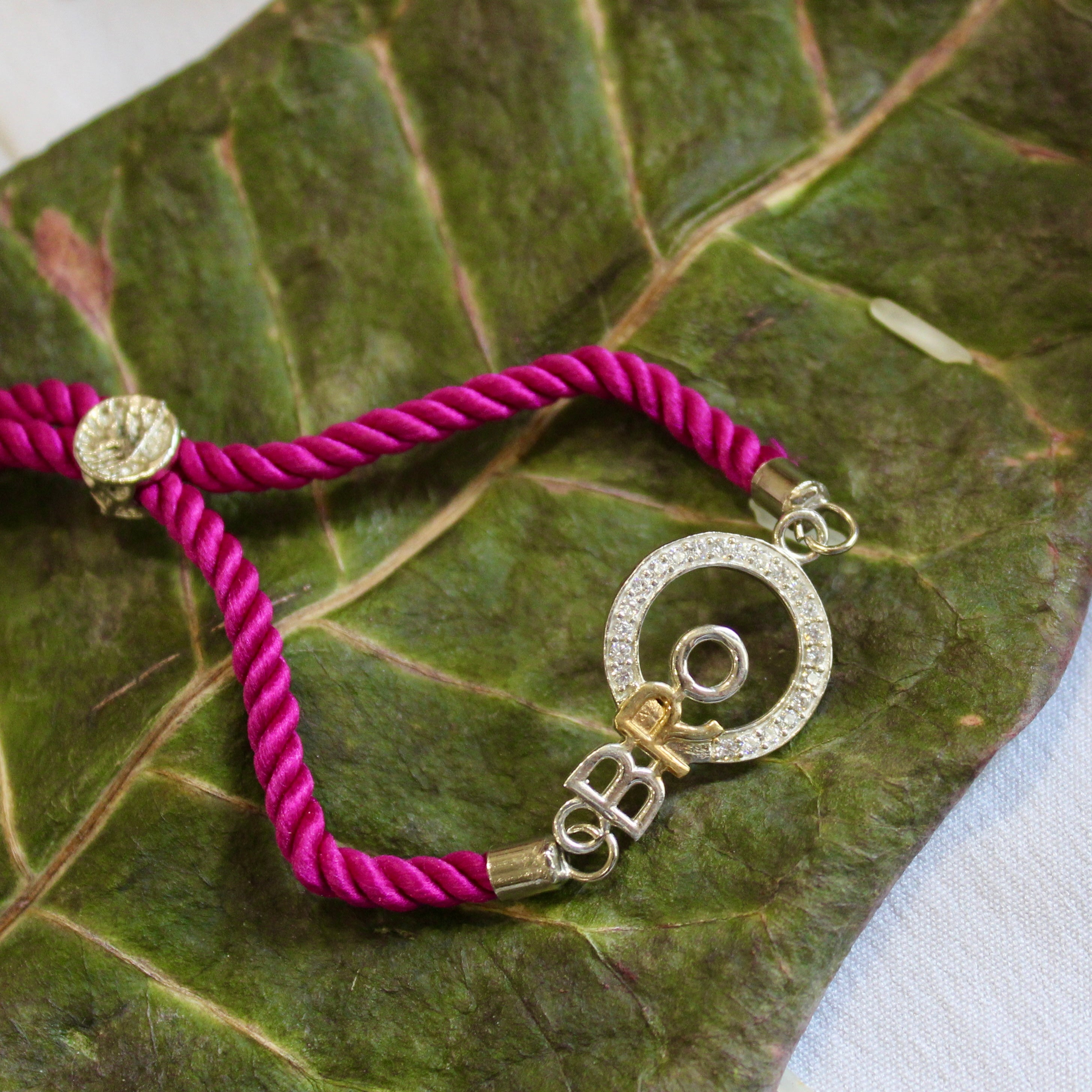 'BRO with circle' purple thread rakhi in 925 Silver