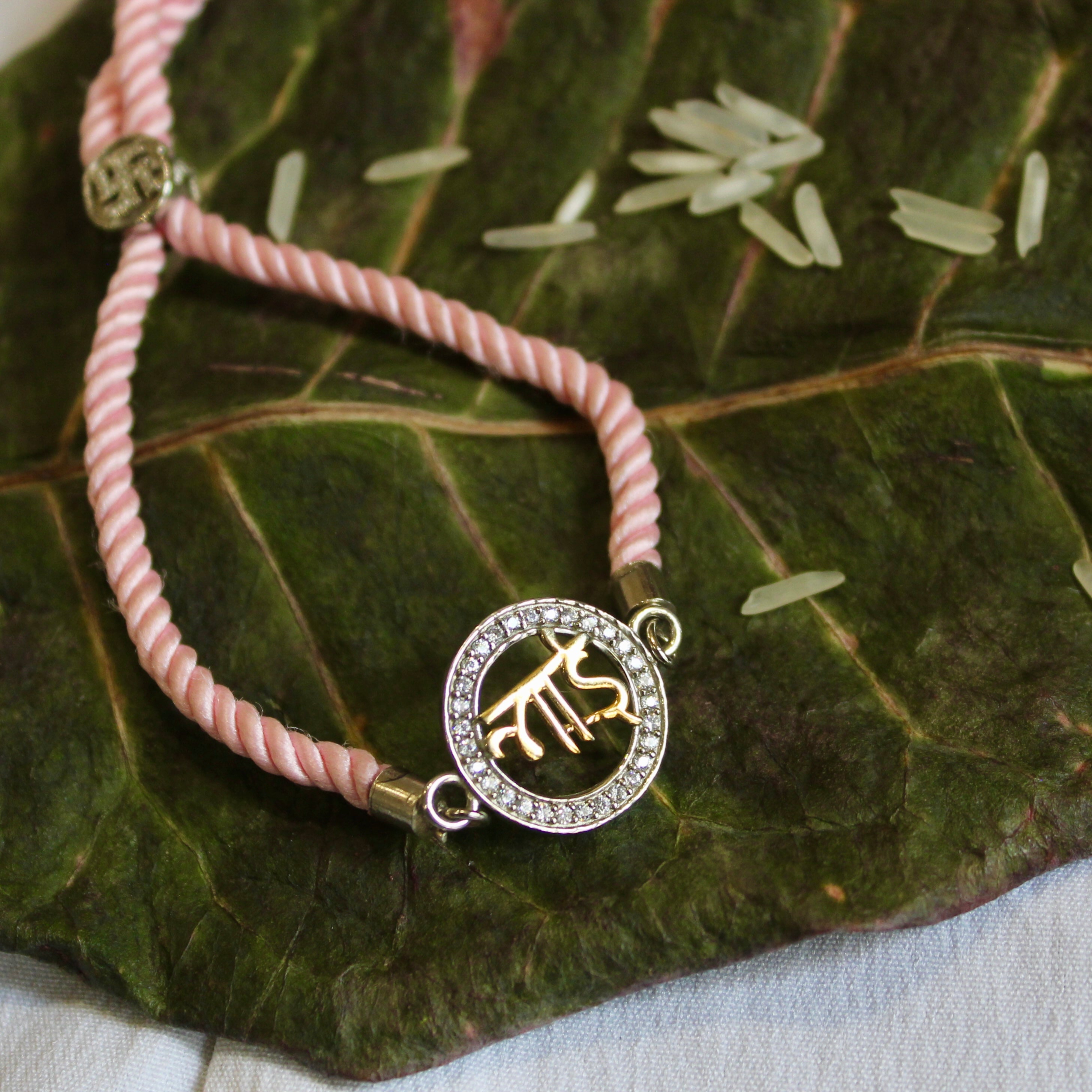 'BHAI In Circle' Pink Thread Rakhi in 925 Silver