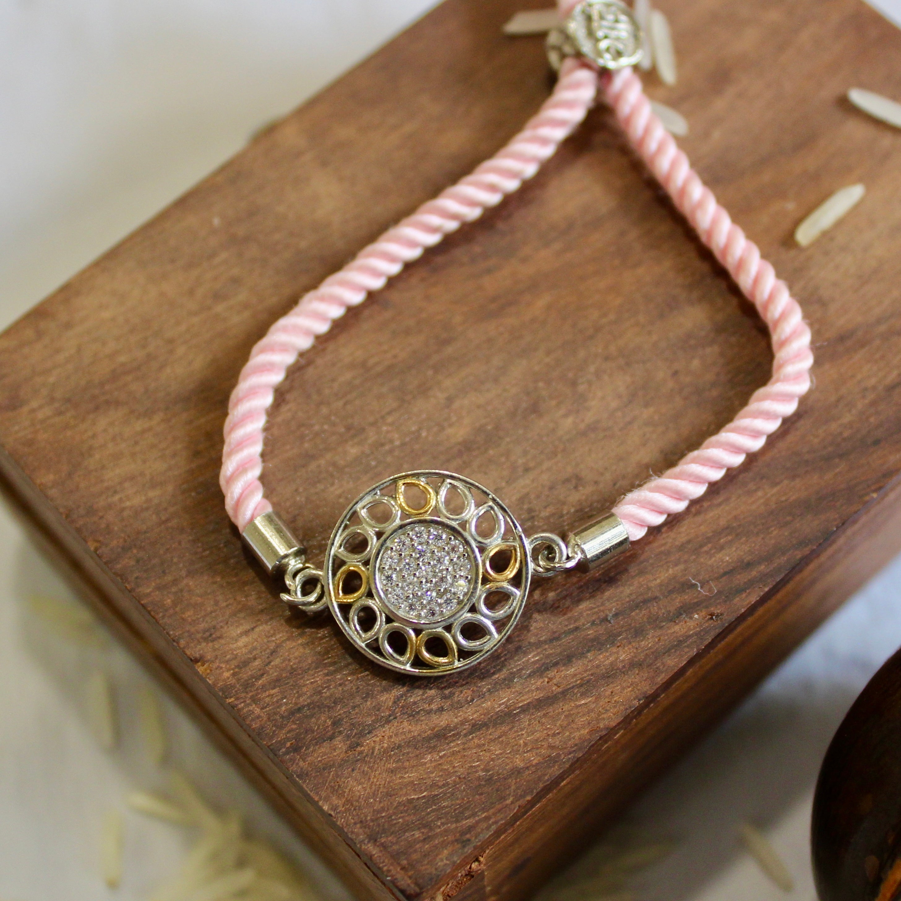 'Flower' Pink Thread Rakhi in 925 Silver
