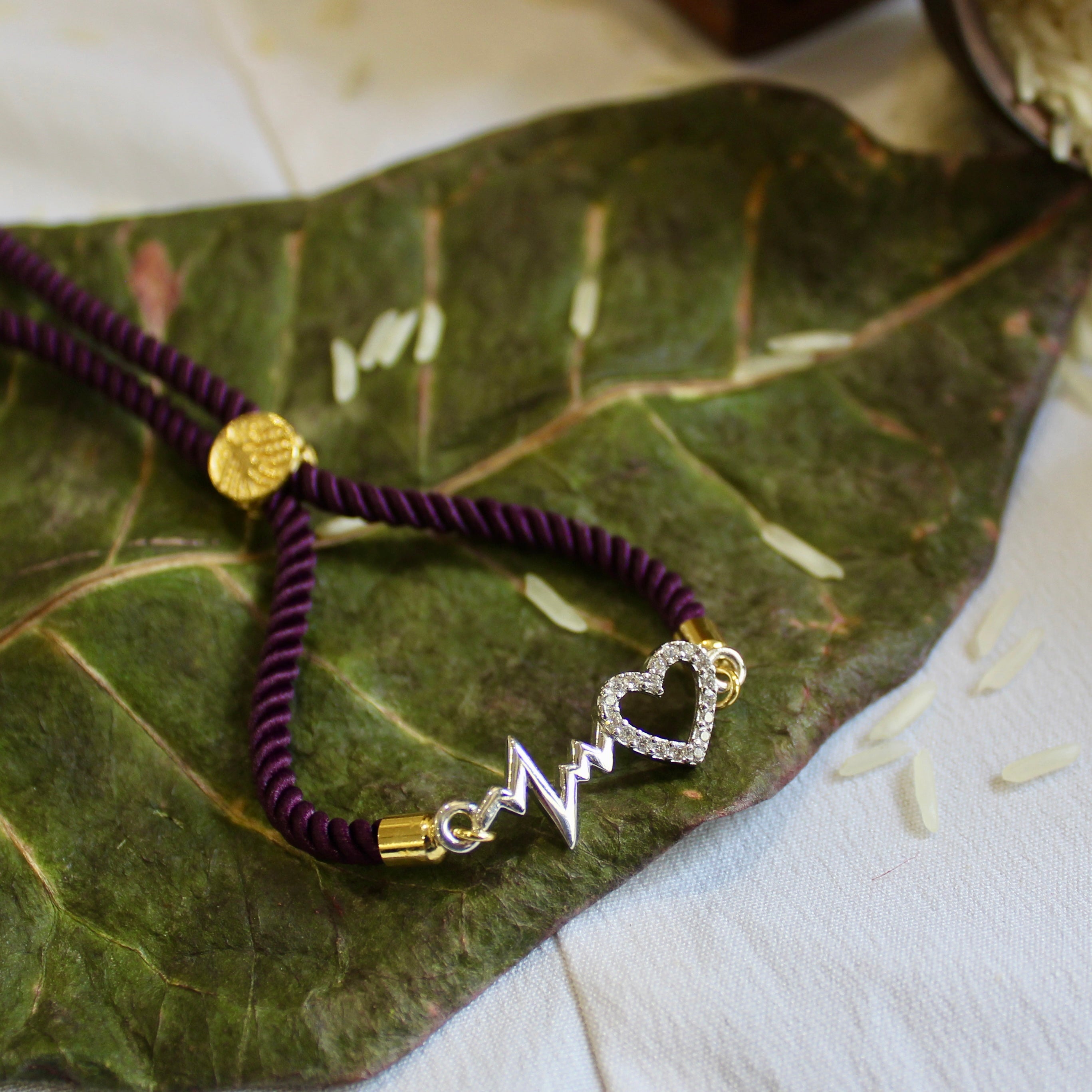'Heartbeat' Purple Thread Rakhi in 925 Silver
