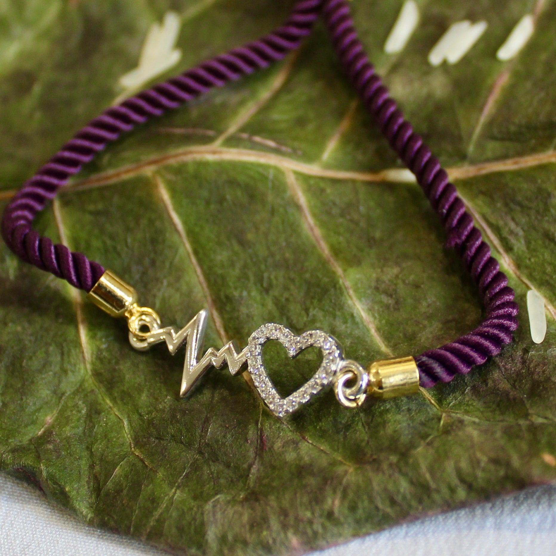 'Heartbeat' Purple Thread Rakhi in 925 Silver