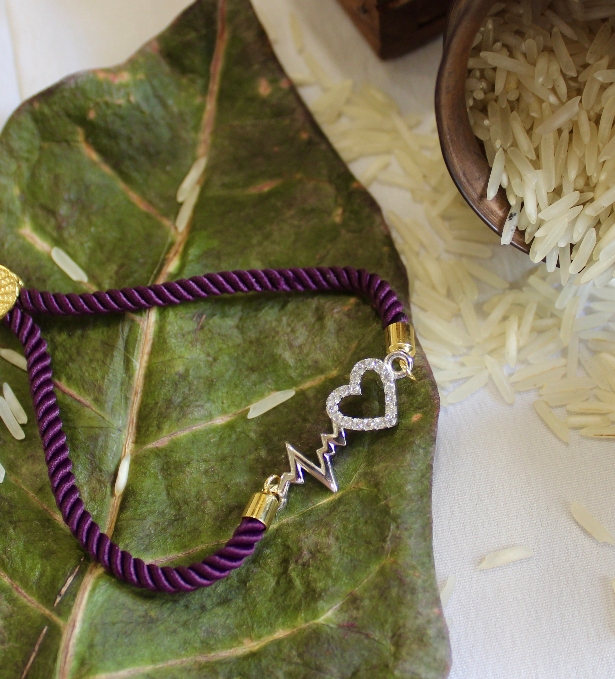 'Heartbeat' Purple Thread Rakhi in 925 Silver