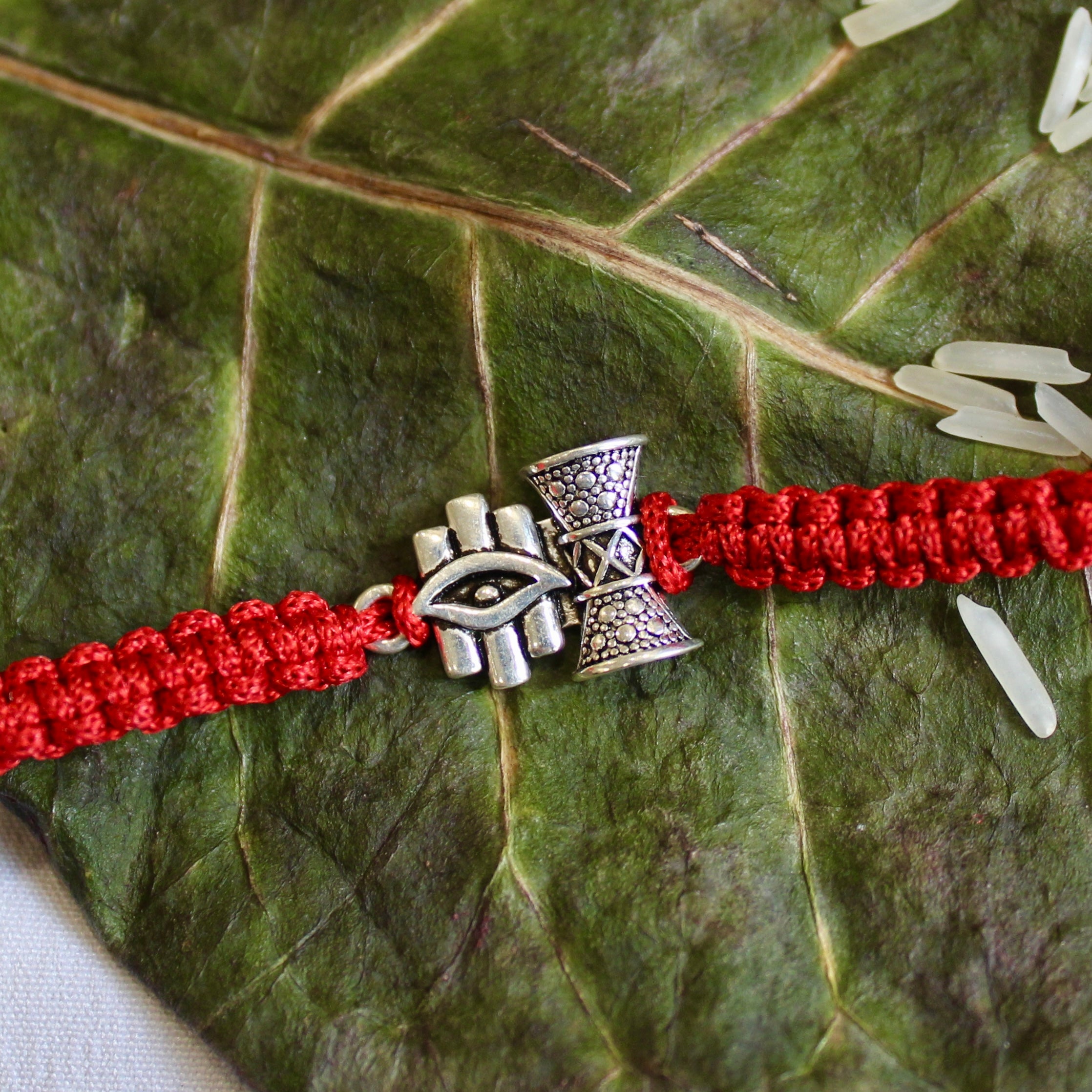 'SHIV DAMRU & EYE' Red Thread Rakhi in 925 Silver