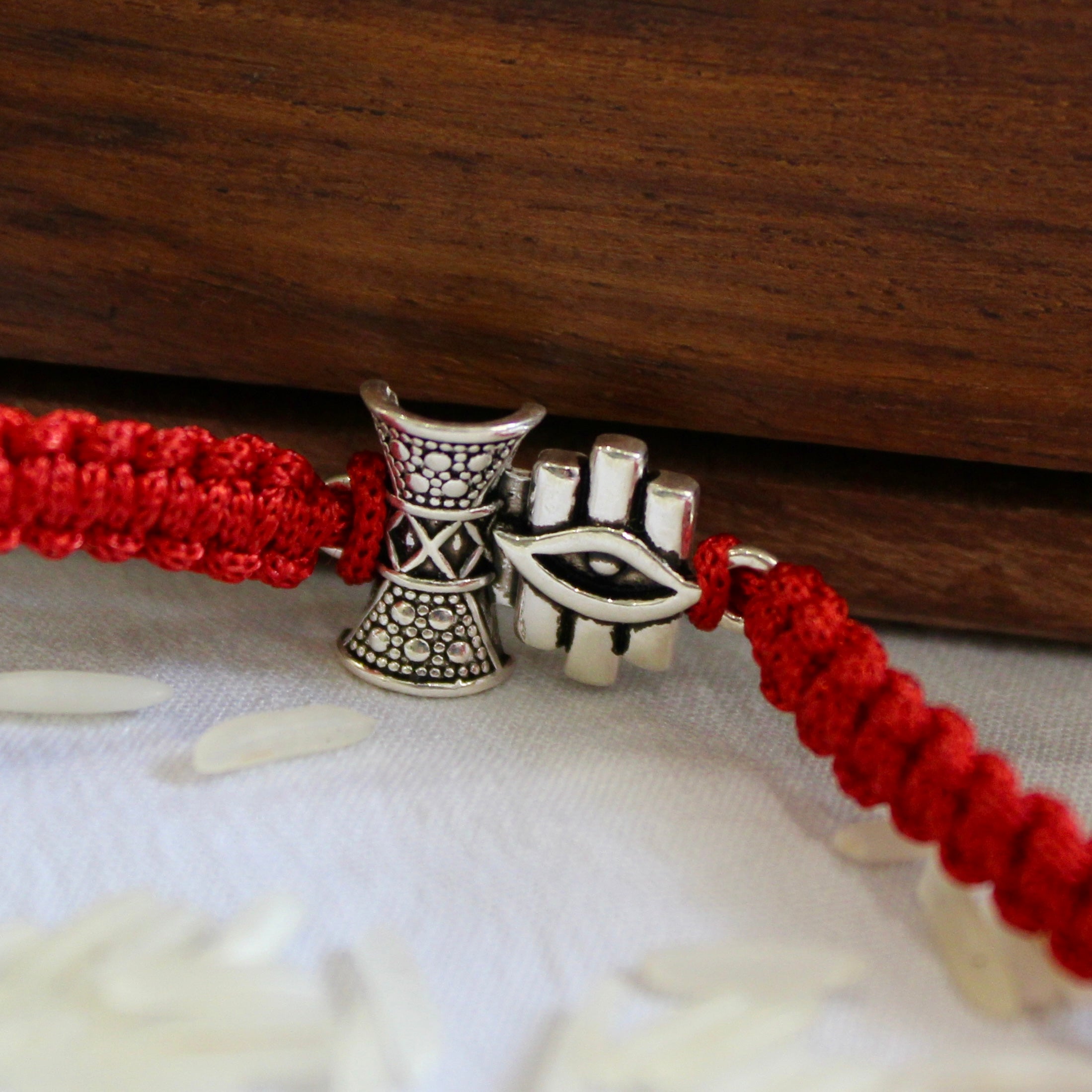 'SHIV DAMRU & EYE' Red Thread Rakhi in 925 Silver