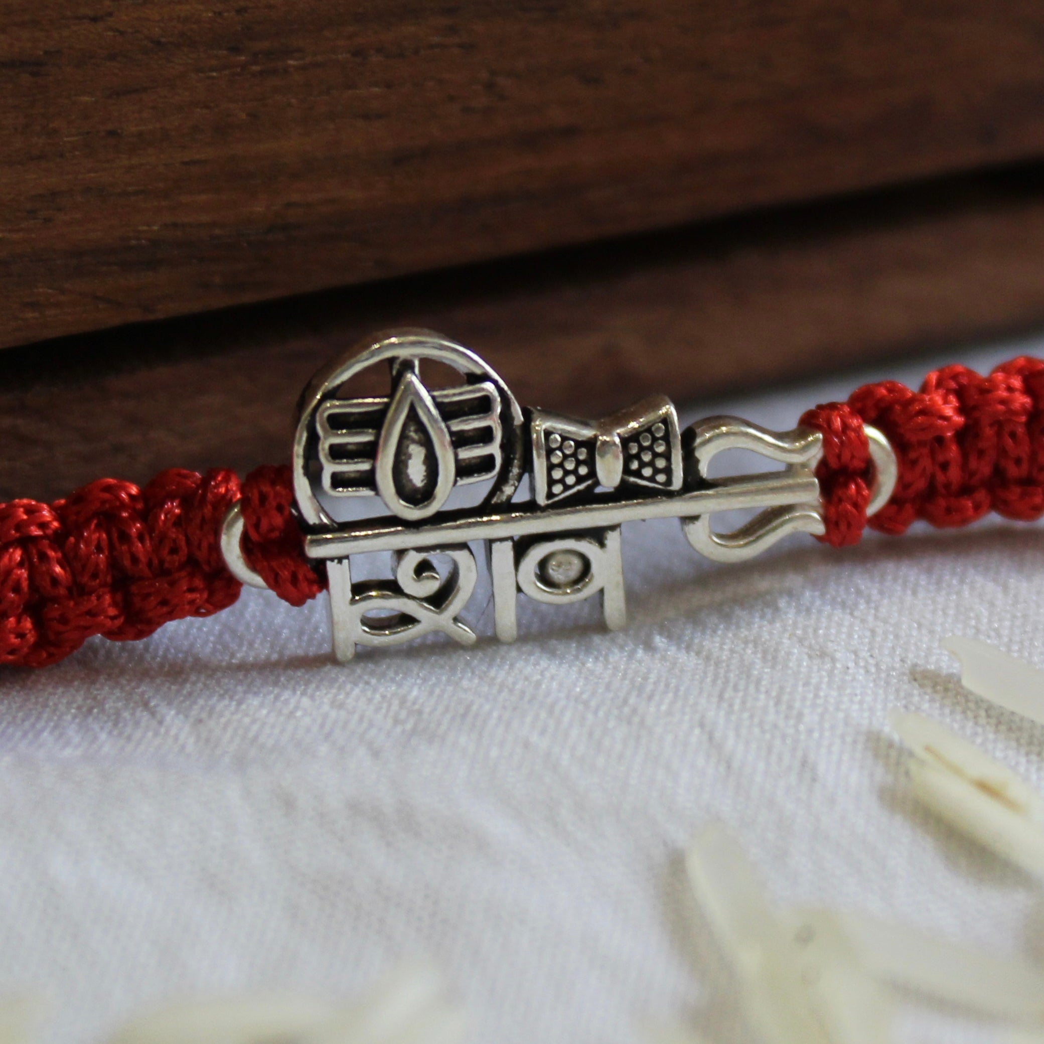'SHIV' Red thread rakhi in 925 Silver