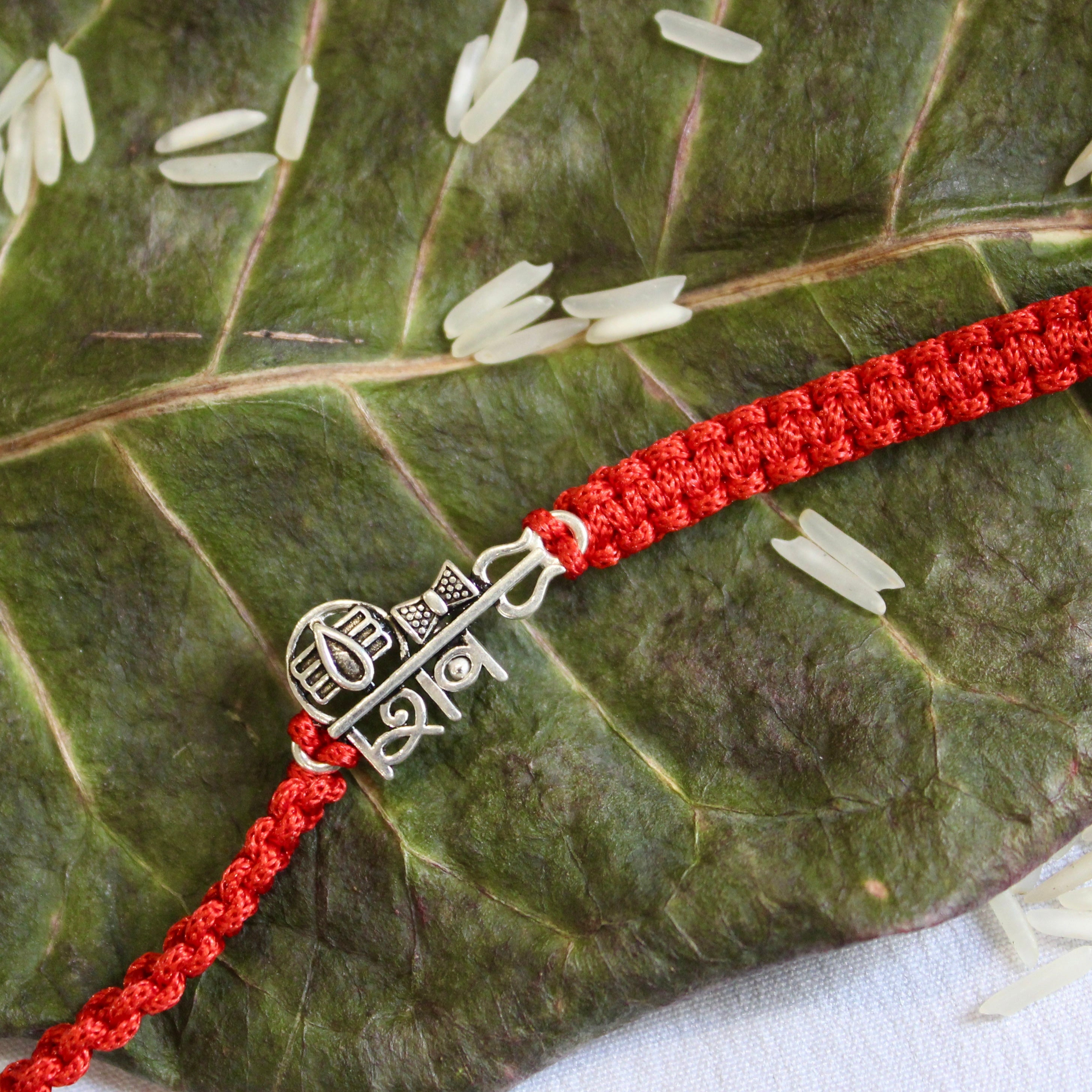 'SHIV' Red thread rakhi in 925 Silver