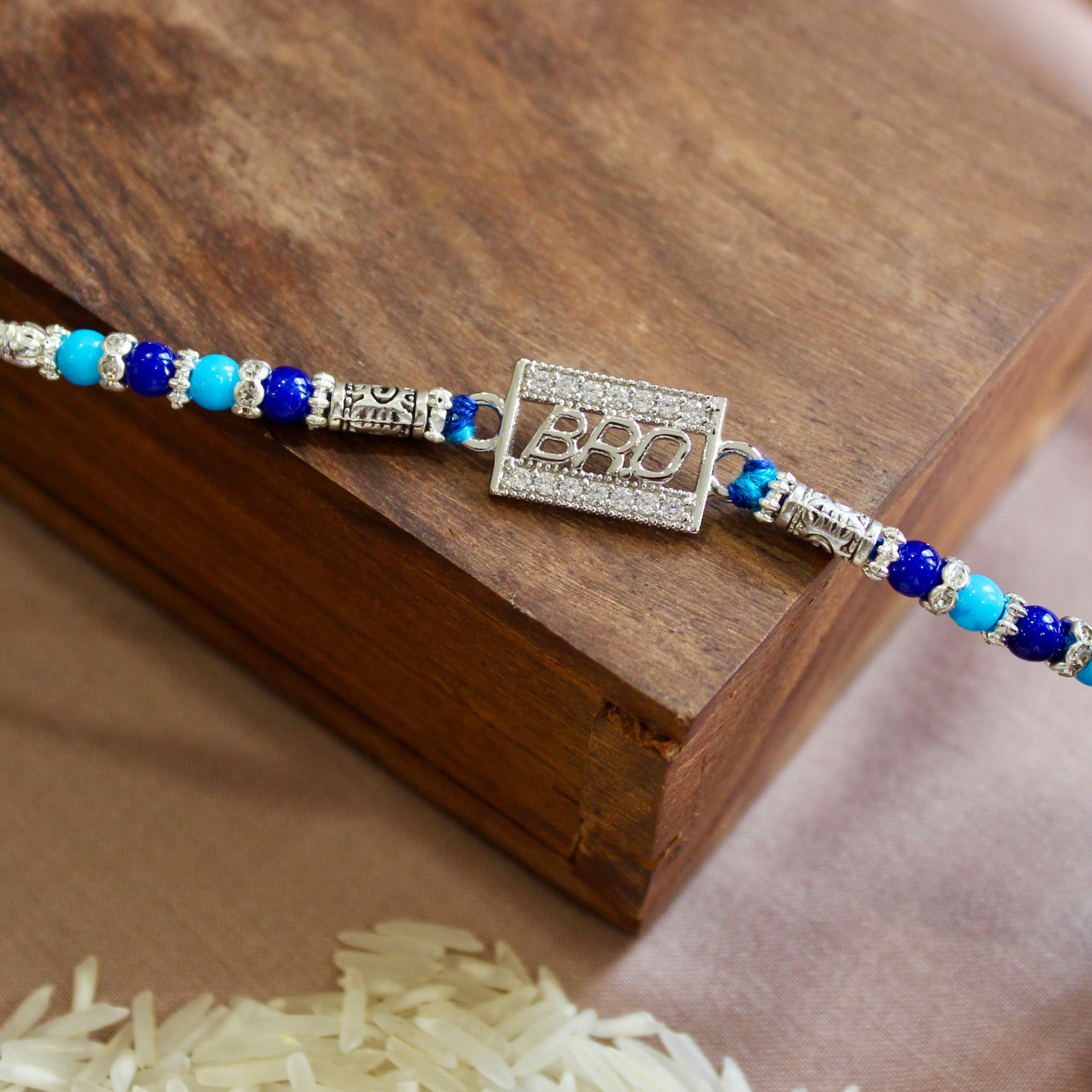 'BRO IN CUBE' Blue Thread Rakhi in 925 Silver