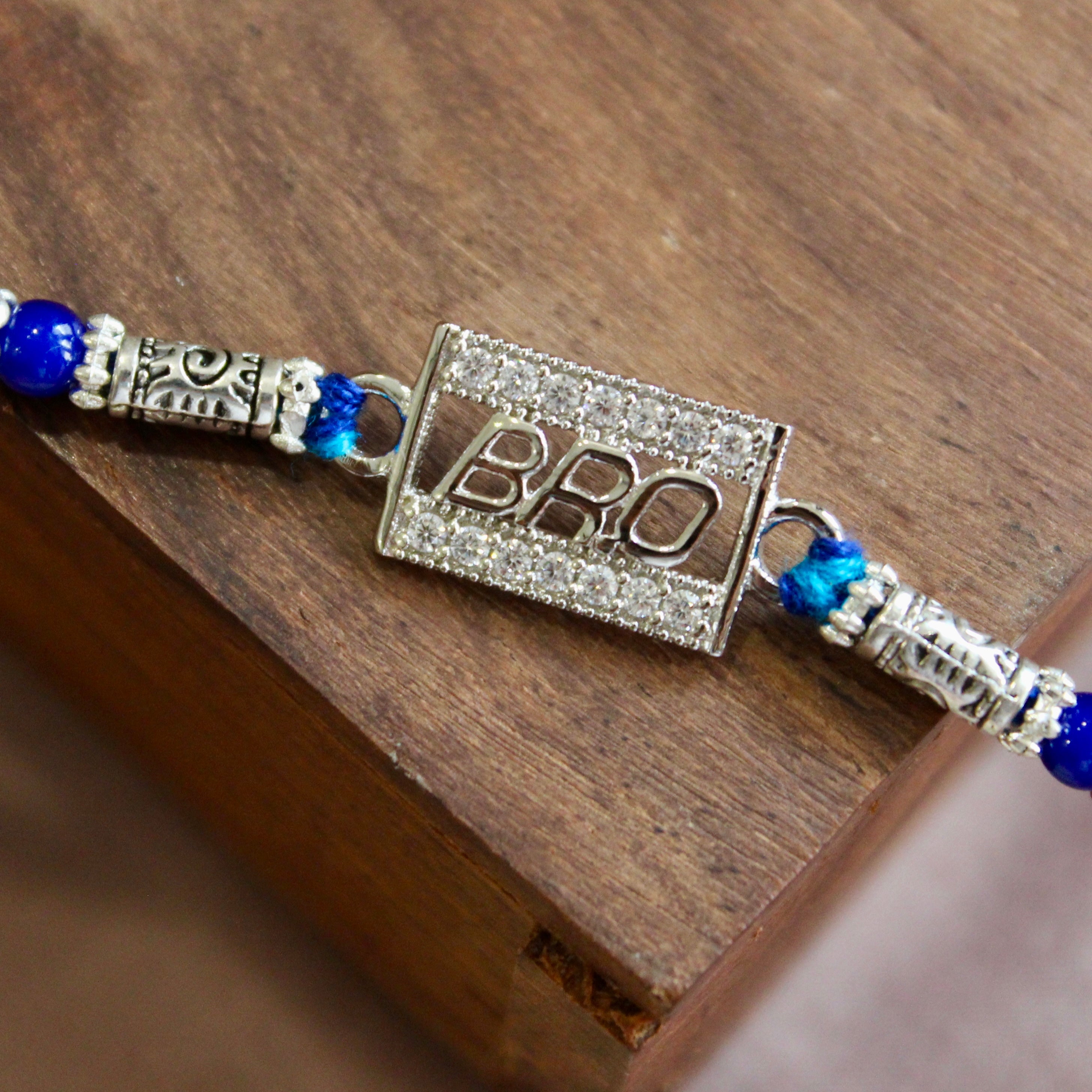 'BRO IN CUBE' Blue Thread Rakhi in 925 Silver