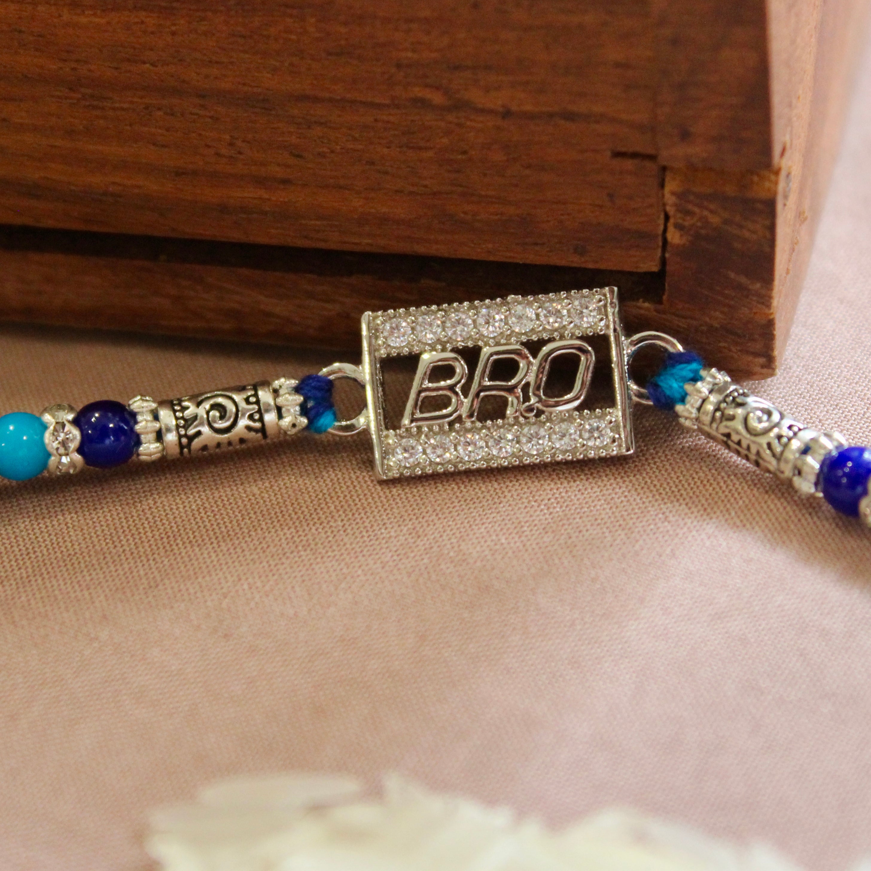 'BRO IN CUBE' Blue Thread Rakhi in 925 Silver