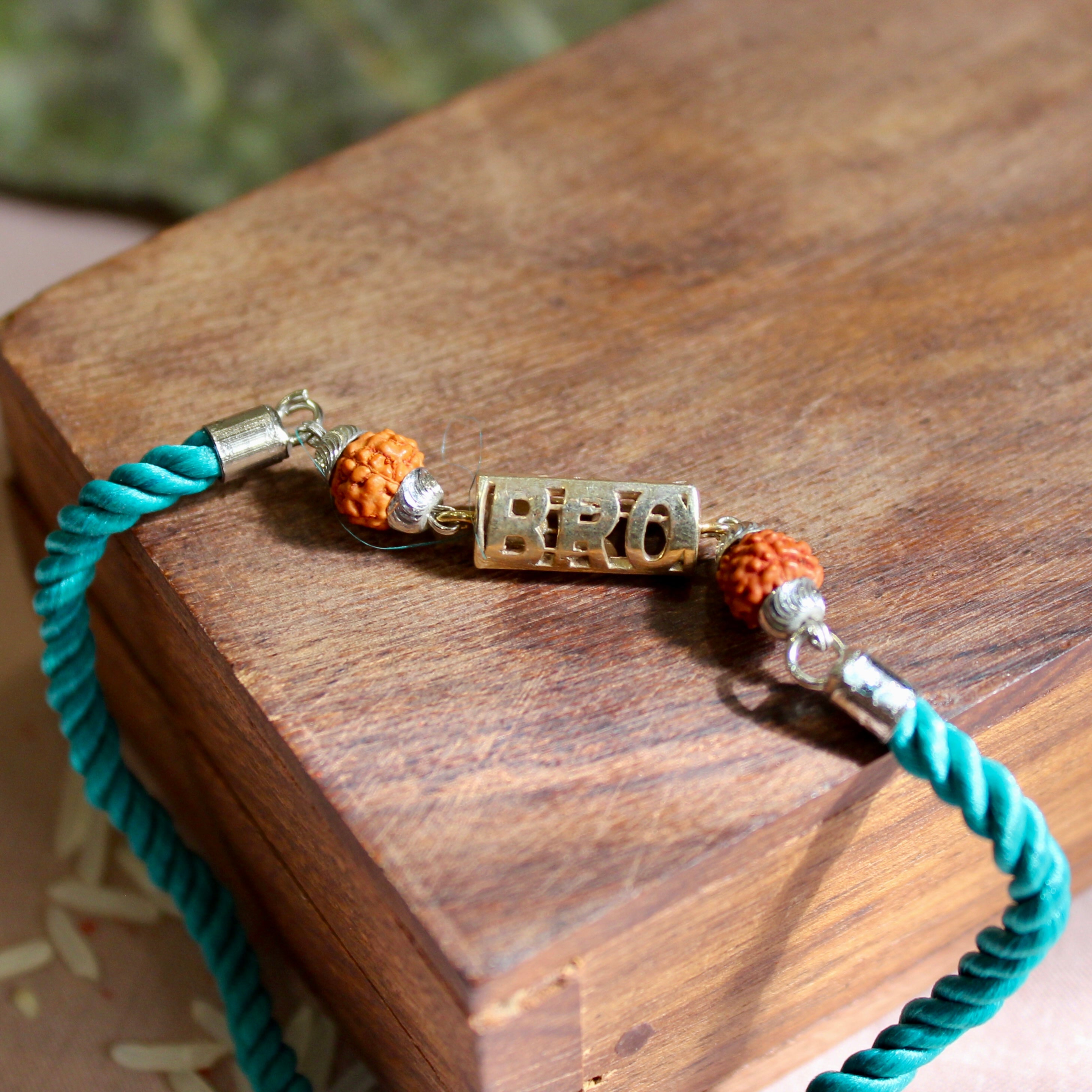 'BRO with Rudraksha' Green Thread Rakhi in 925 Silver
