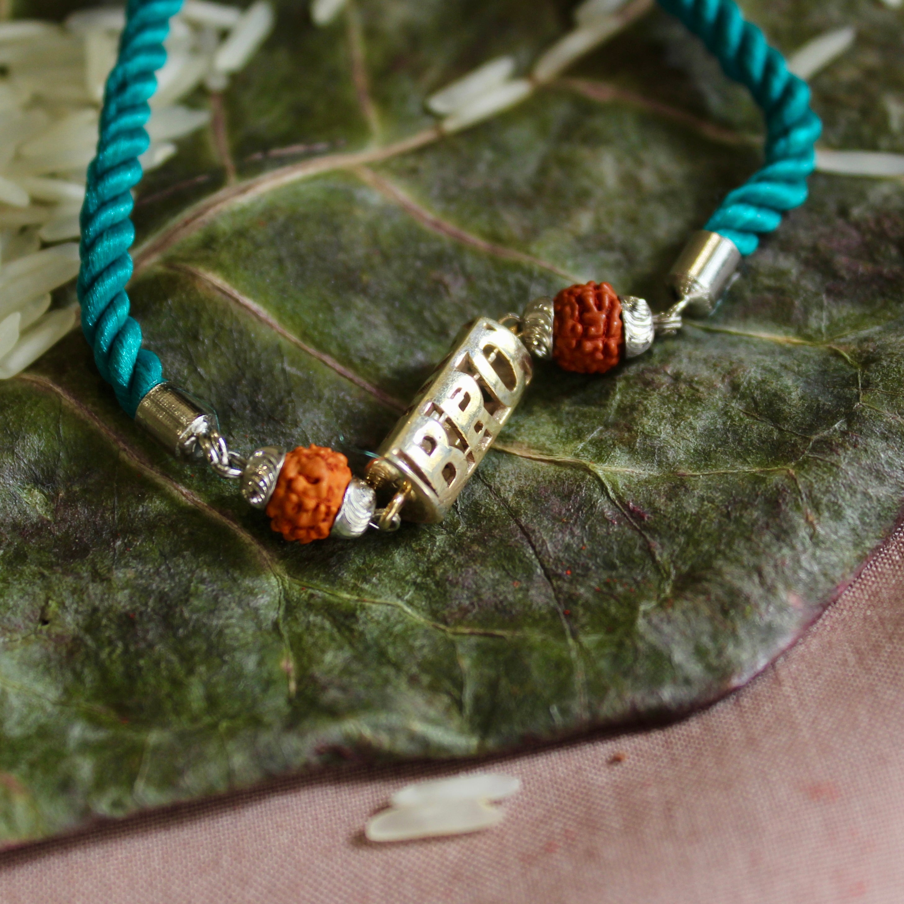 'BRO with Rudraksha' Green Thread Rakhi in 925 Silver