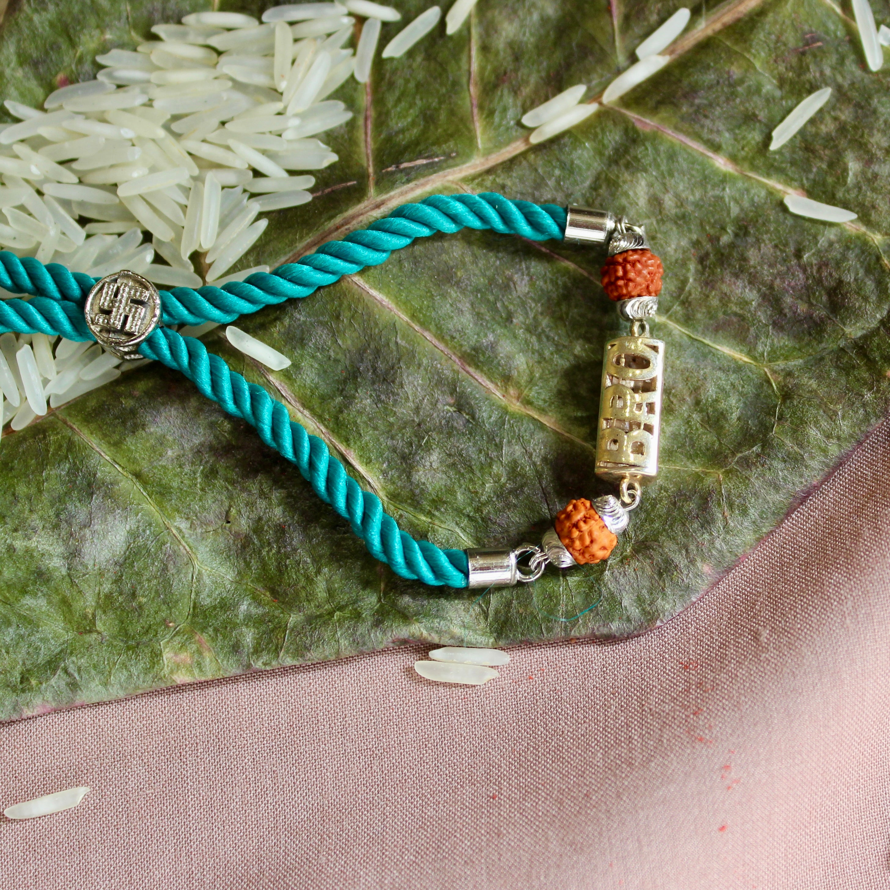 'BRO with Rudraksha' Green Thread Rakhi in 925 Silver