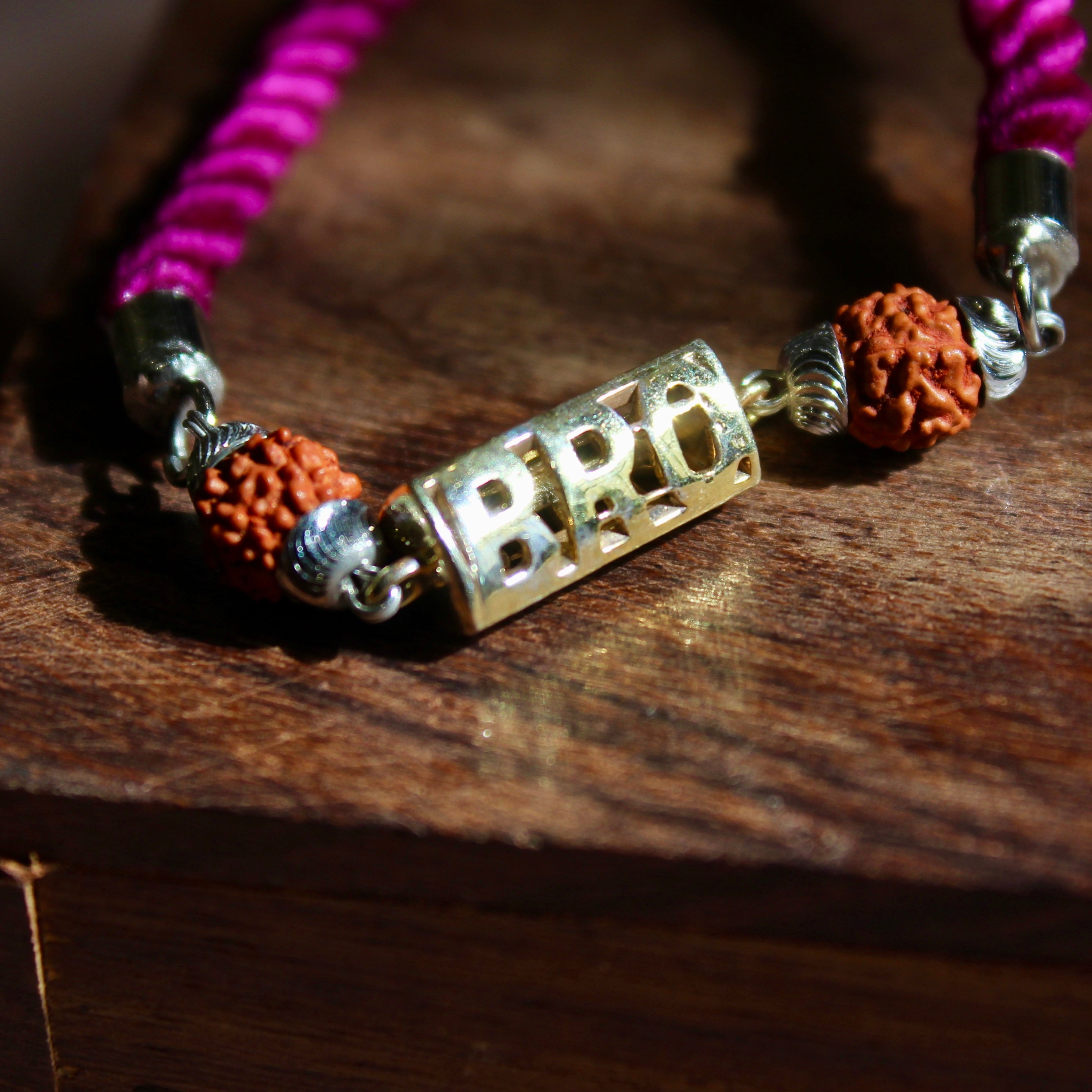 'BRO with Rudraksh' Pink Thread Rakhi in 925 Silver