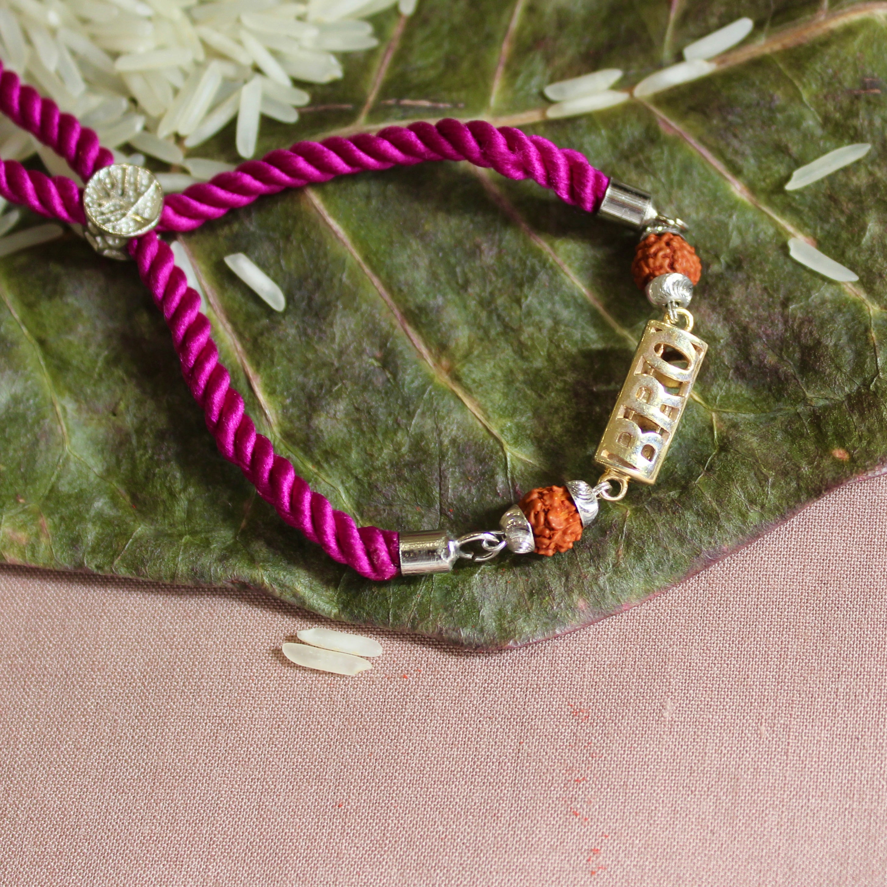'BRO with Rudraksh' Pink Thread Rakhi in 925 Silver