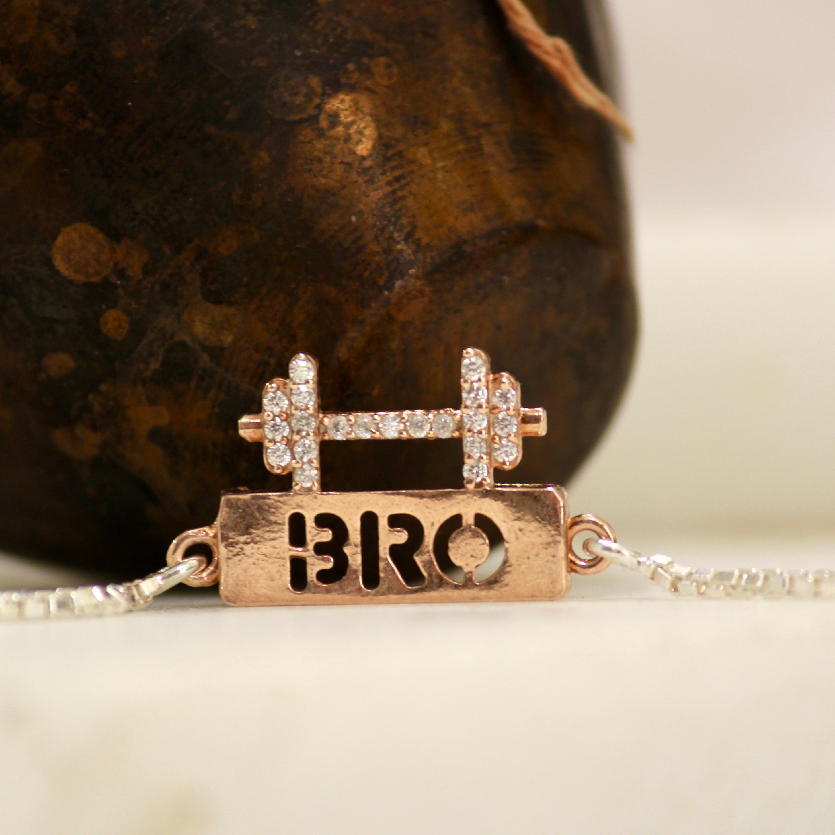 BRO WITH DUMBELL rose gold chained rakhi in 925 silver