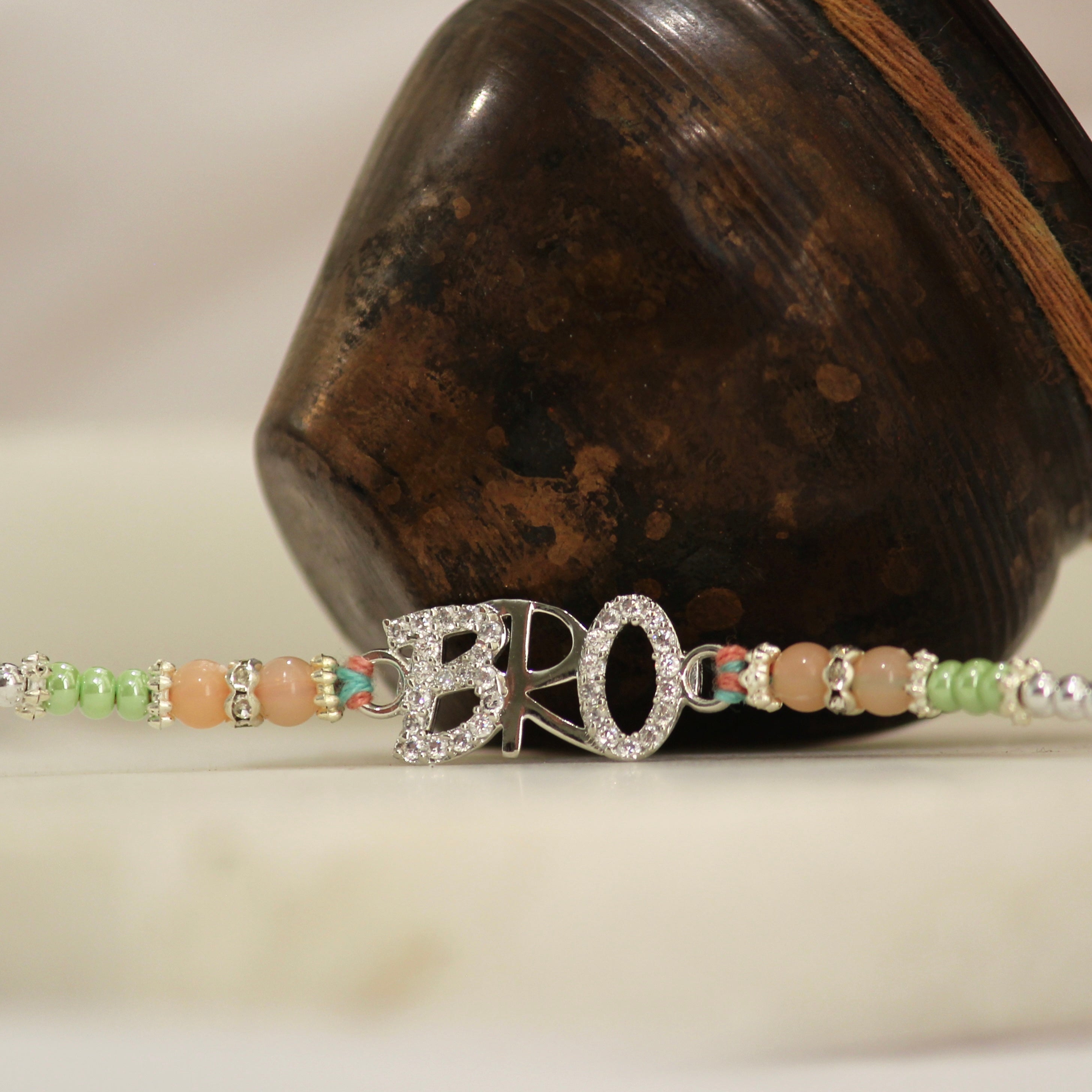 BRO 925 silver peach thread rakhi