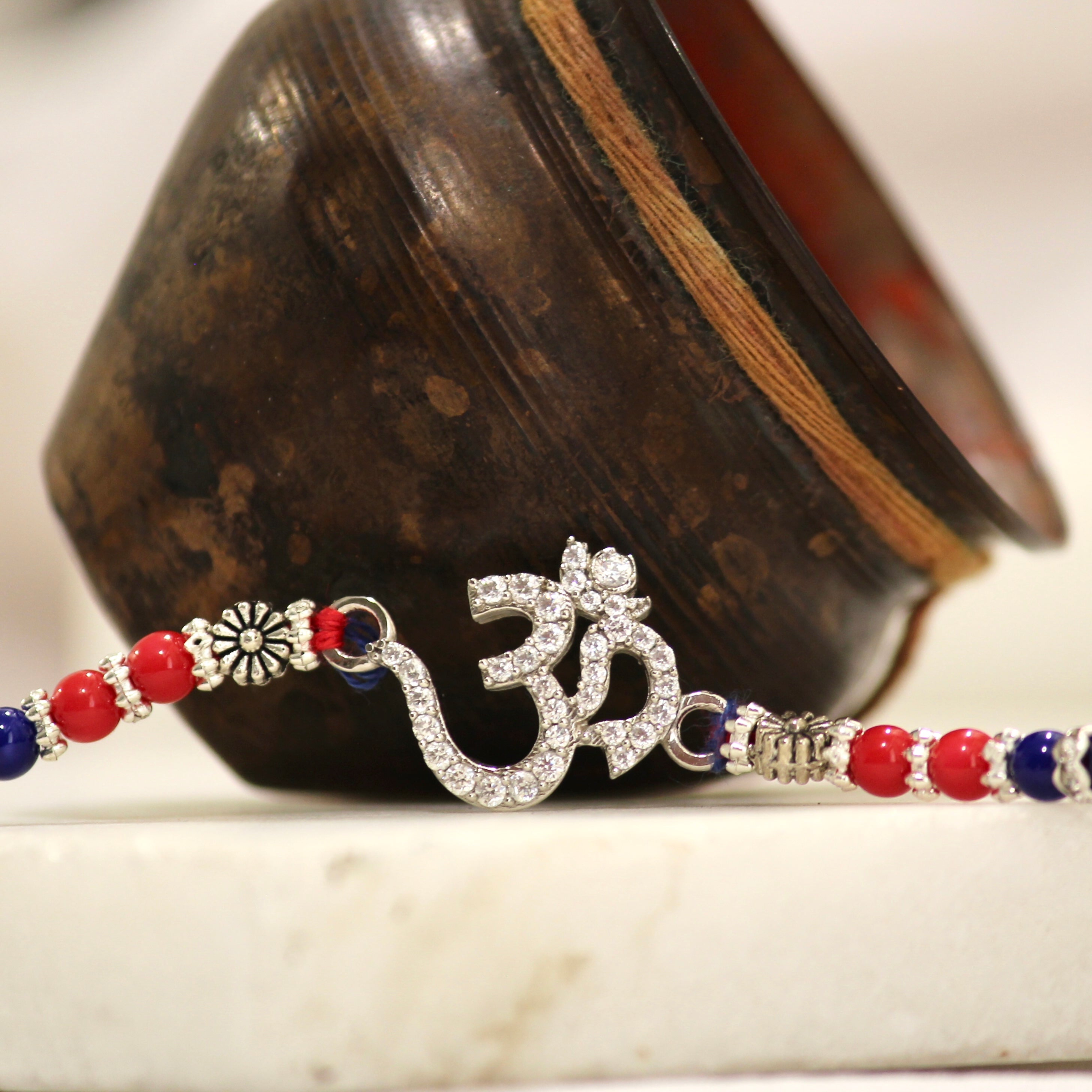 OM WITH ZIRCON STONES 925 silver red thread rakhi