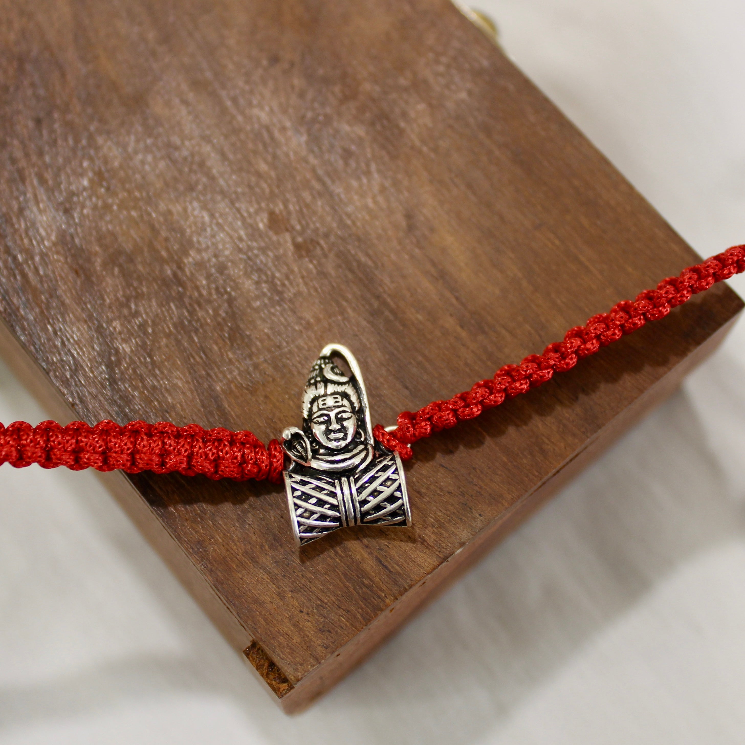 MAHADEV WITH DAMRU 925 silver red thread rakhi