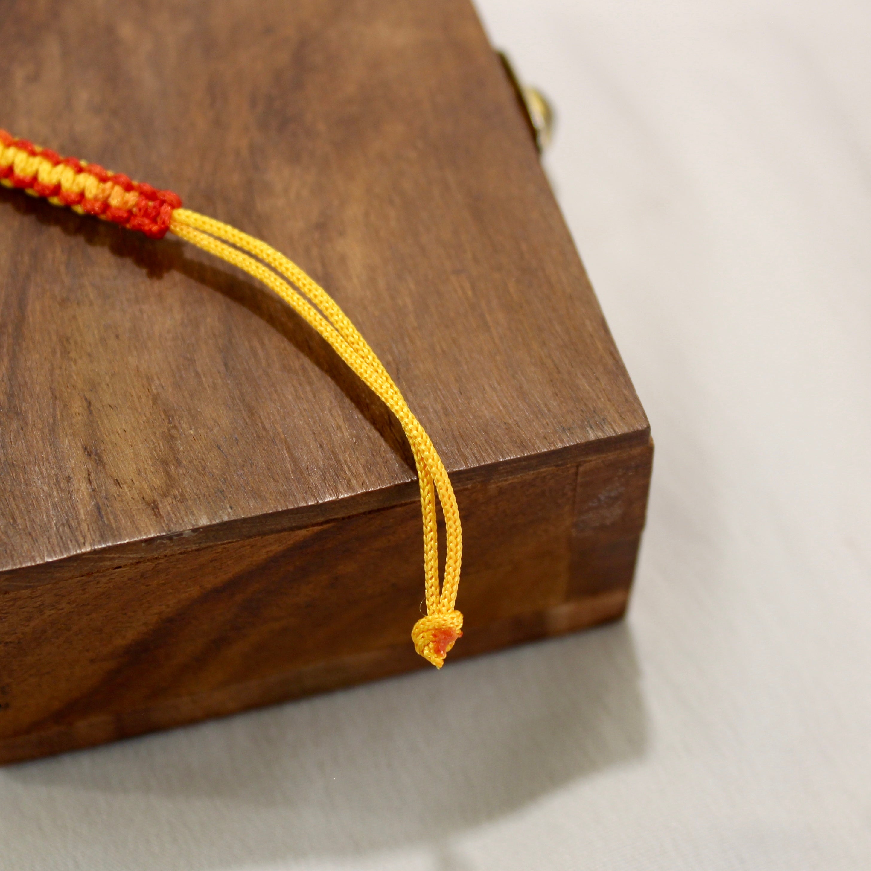 RUBY STONE mini circle red thread rakhi in 925 silver