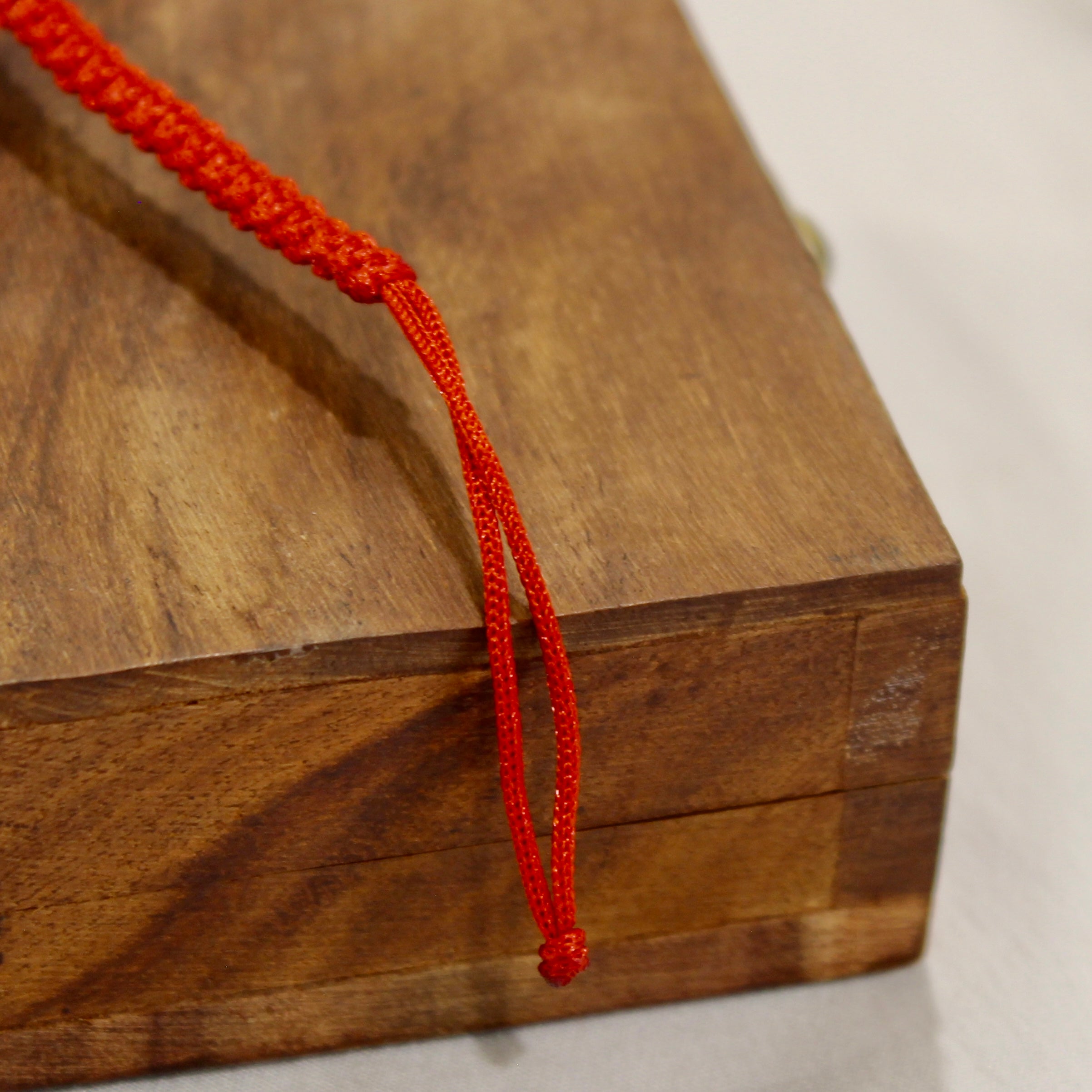 BIG OM red thread rakhi in 925 silver