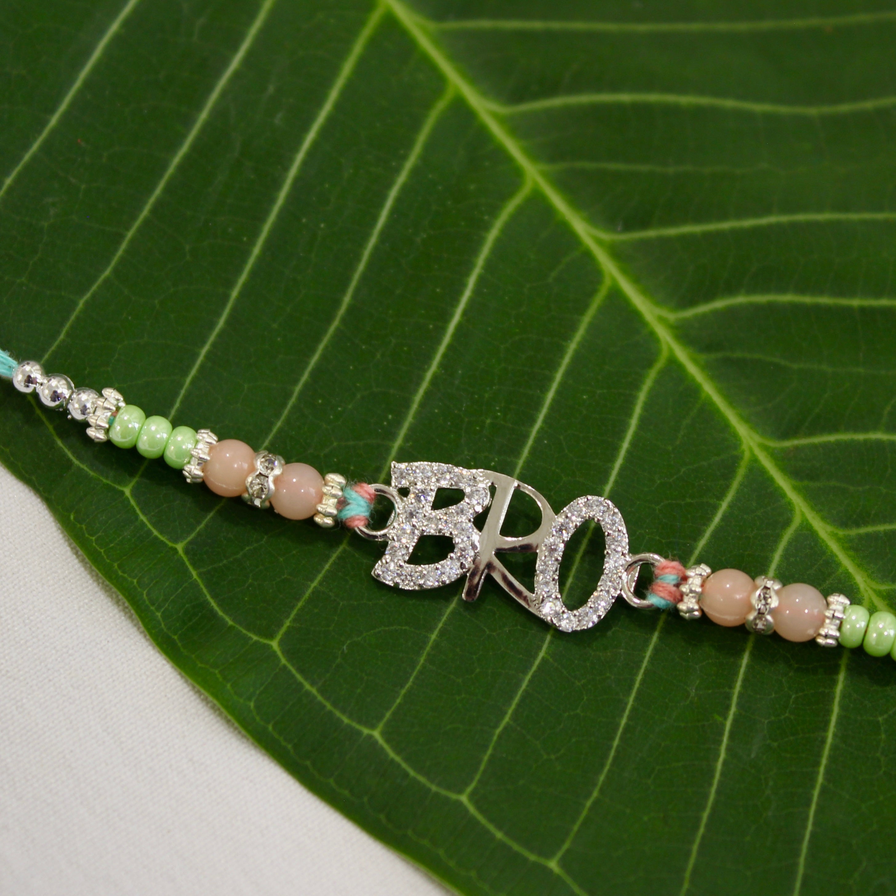 BRO 925 silver peach thread rakhi