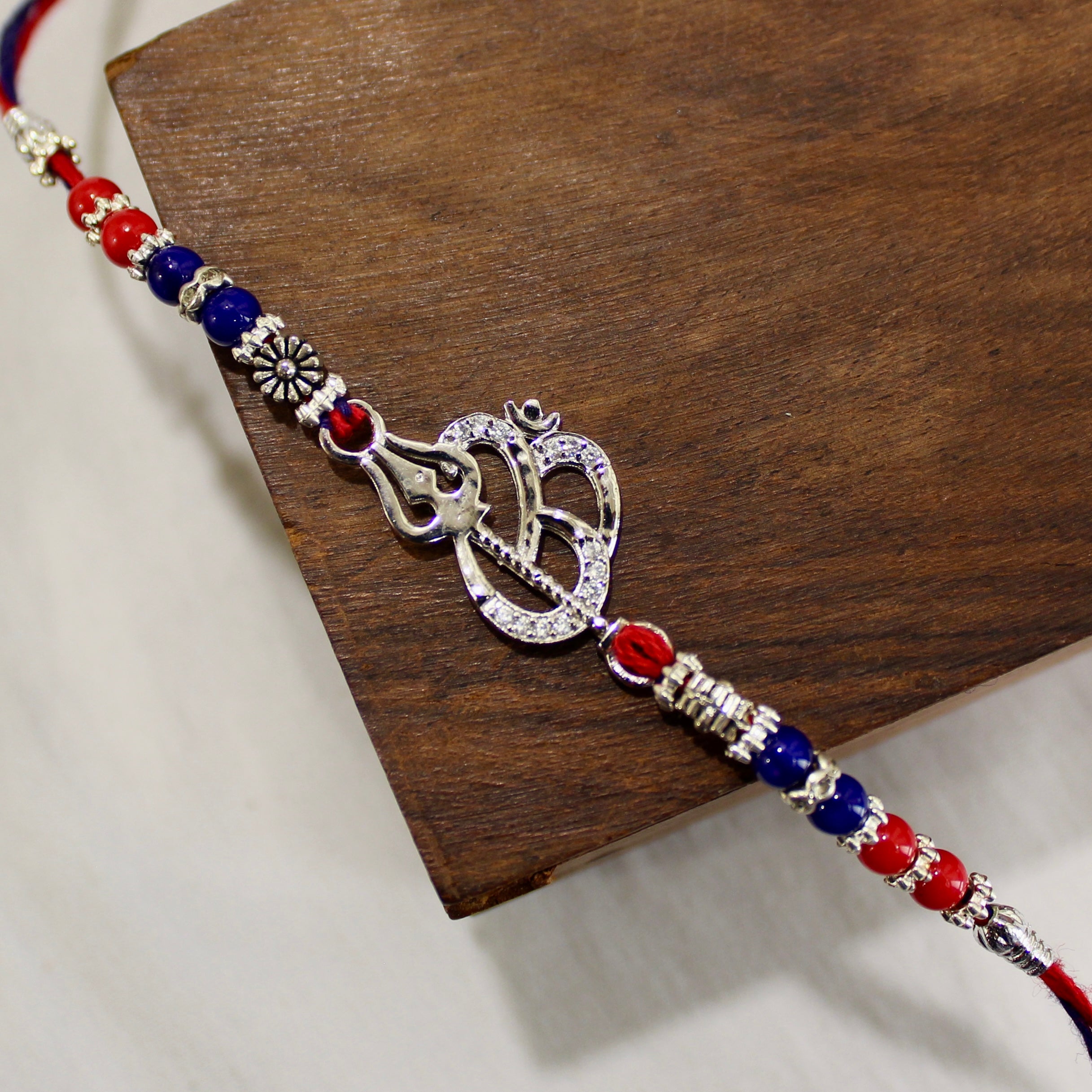 OM WITH TRISHUL 925 silver red thread rakhi