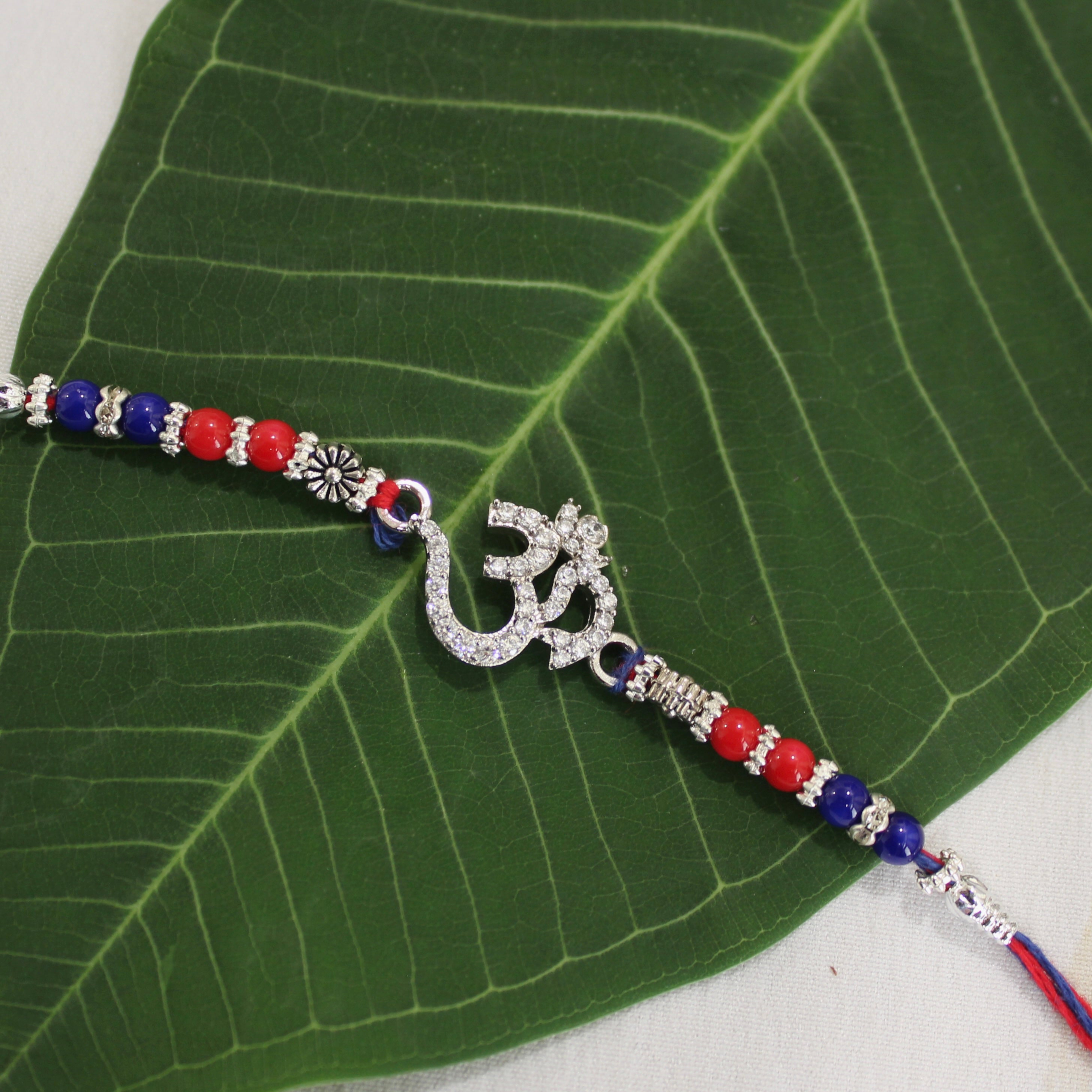 OM WITH ZIRCON STONES 925 silver red thread rakhi