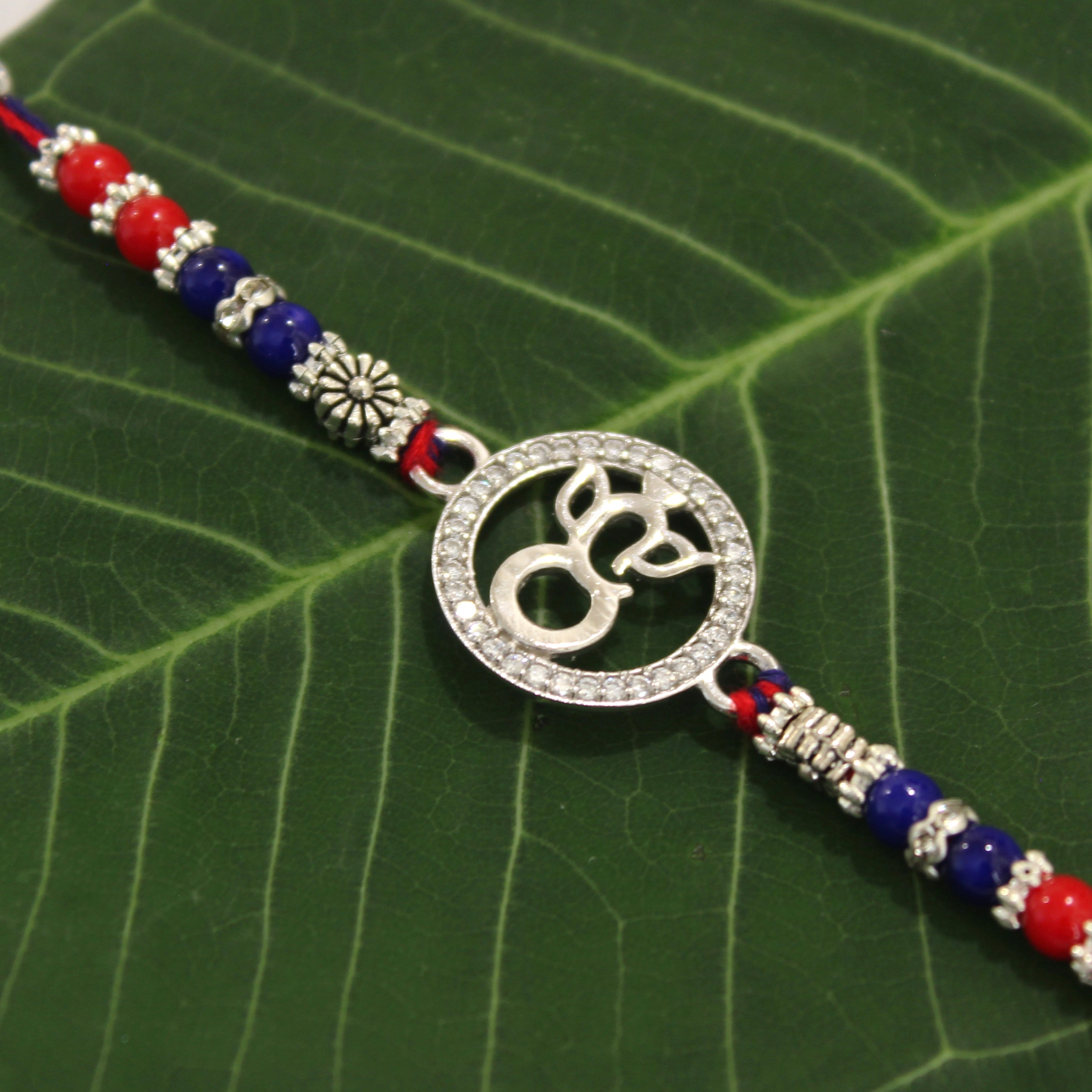 LORD GANESHA IN CIRCLE 925 silver red thread rakhi
