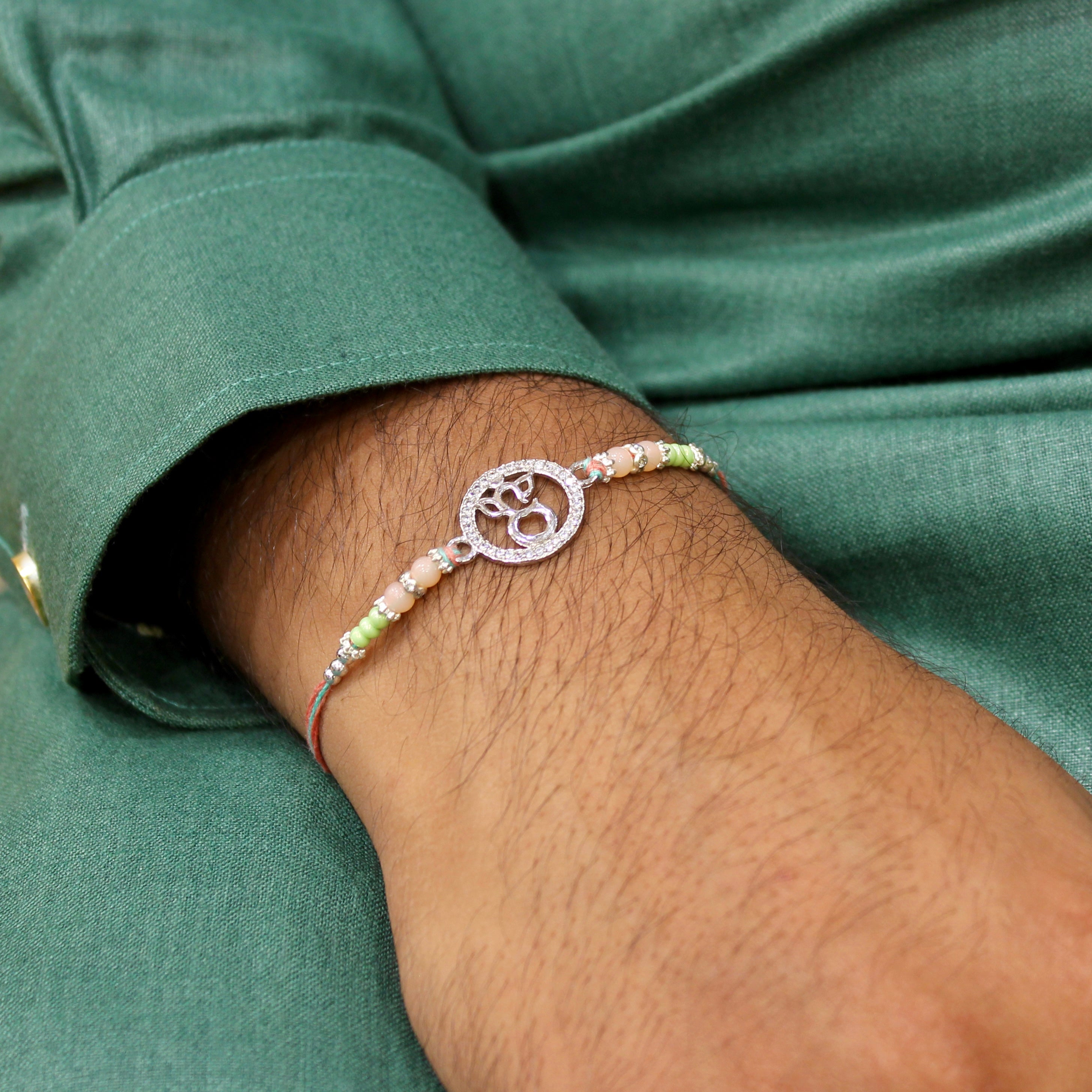 LORD GANESHA IN CIRCLE 925 silver peach thread rakhi